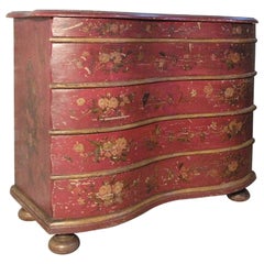 Commode allemande du 18ème siècle peinte en rouge avec façade serpentine