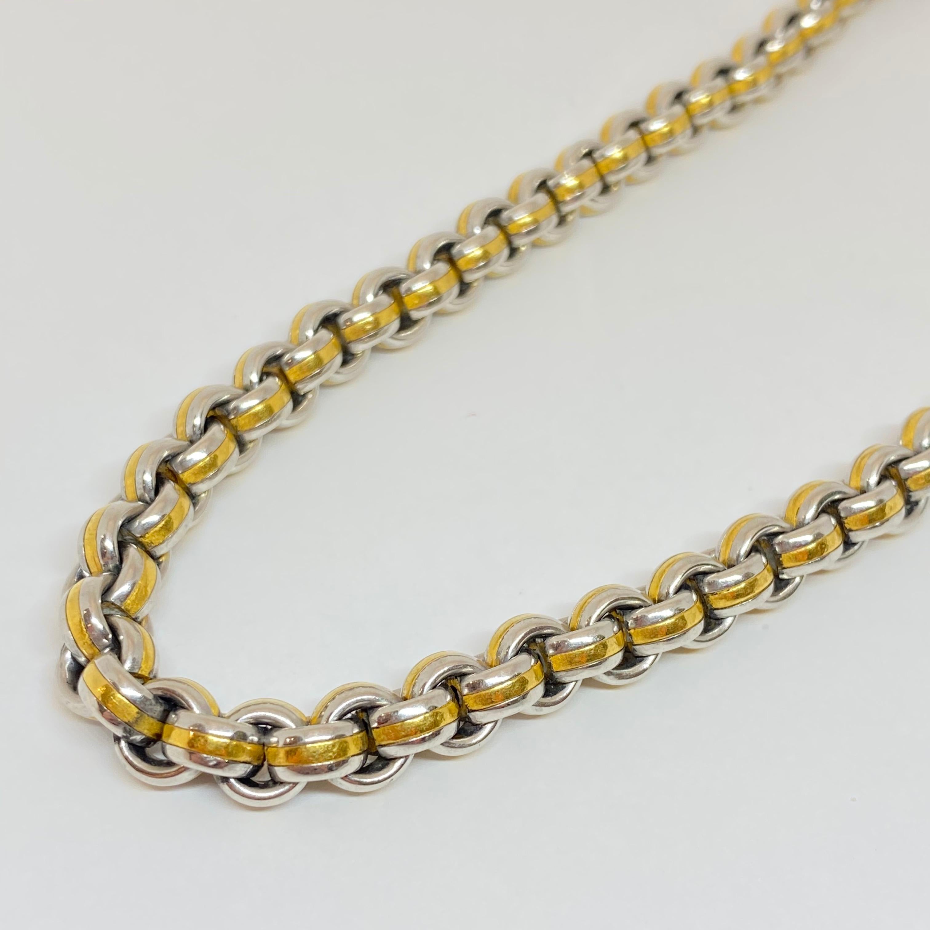 Vintage estate necklace designed in heavy platinum and 22 karat solid rolled yellow gold. The necklace measures 8mm wide, 17.50 