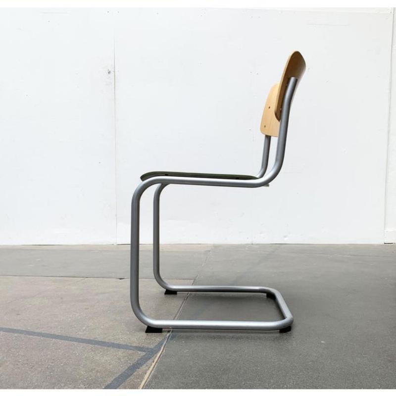 This is a classic under the steel pipe furniture. The Thonet chair S43 according to a design by Mart Stam from the 1920s.

It is a simple and timeless functional design. The steel tube of this version is silver and gray. The original seat was