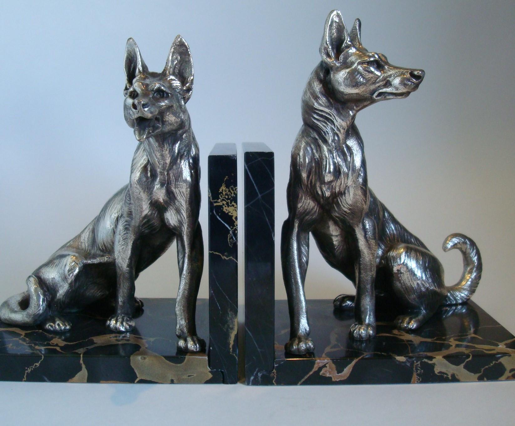 German Shepherd dog sculpture bookends by Louis-Albert Carvin.
Louis-Albert Carvin Dog Animalier Art Deco Sculpture Bookends in Marble and Silvered Metal. Pair of large Silvered Metal Sculptures of two German shepherds mounted on marble bases by
