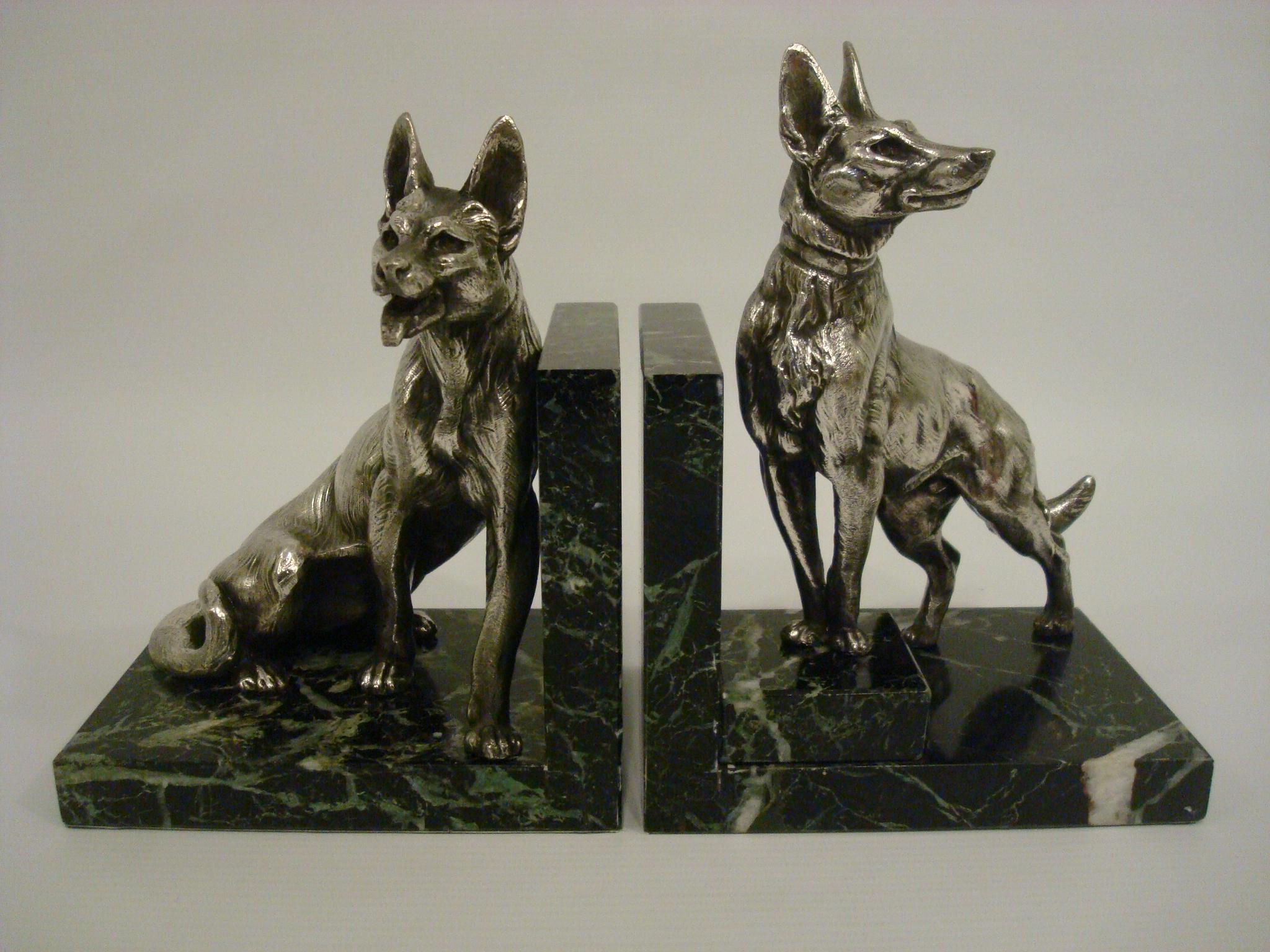 German Shepherd dog sculpture bookends by Louis-Albert Carvin.
Dog Animalier Art Deco Sculpture Bookends in Marble and Silvered Metal. Pair of large Silvered Metal Sculptures of two German shepherds mounted on marble bases
Born in Paris in 1875
