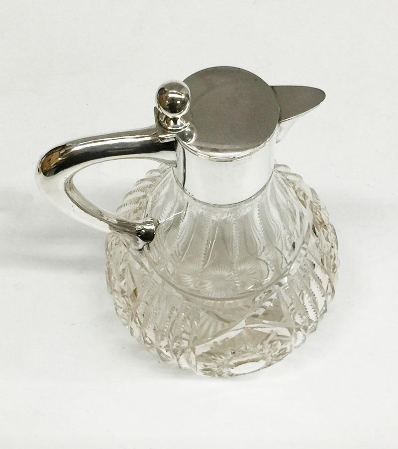 German Silver 800/1000 mounted crystal cut glass water jug

circa 1960-1970
Marked with Hall mark German Silver, 800 / 1000

The measurements are 24 cm high, 18 cm wide and the depth is 15 cm
The weight is 1396 gram.