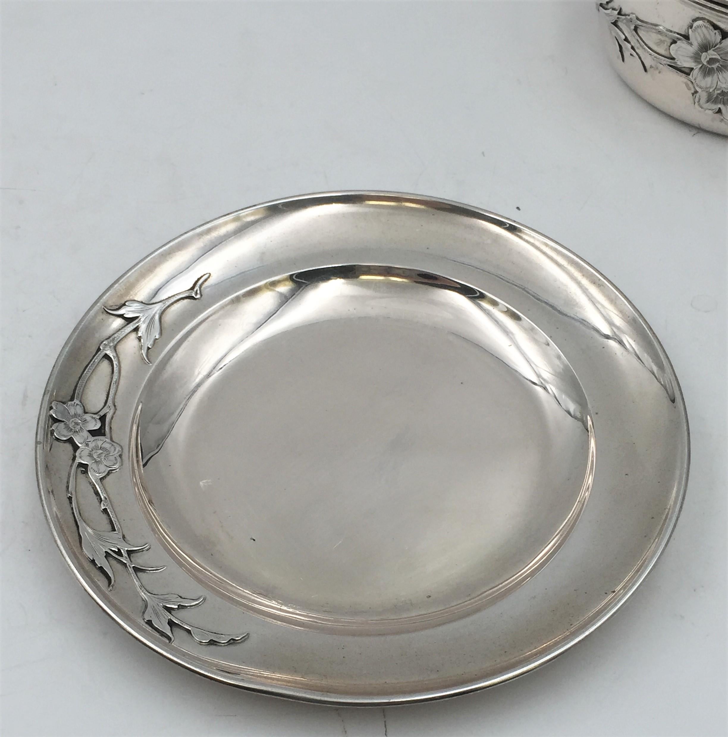 19th century German continental silver butter dish and covered bowl/ tureen in exquisite Art Nouveau style with applied floral decorations. The two-handled bowl is gilt inside and has a wood finial atop. The dish measures 6 3/4” in diameter by 2/3”