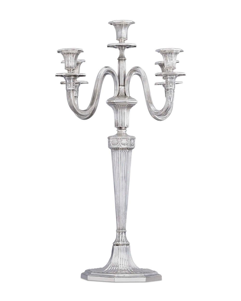 One of the oldest and most esteemed silver firms in Germany, Bruckmann & Söhne, created this wonderful pair of antique silver five-light candelabra. The Neoclassical forms are distinguished by elegant repoussé fluting punctuated by diminutive