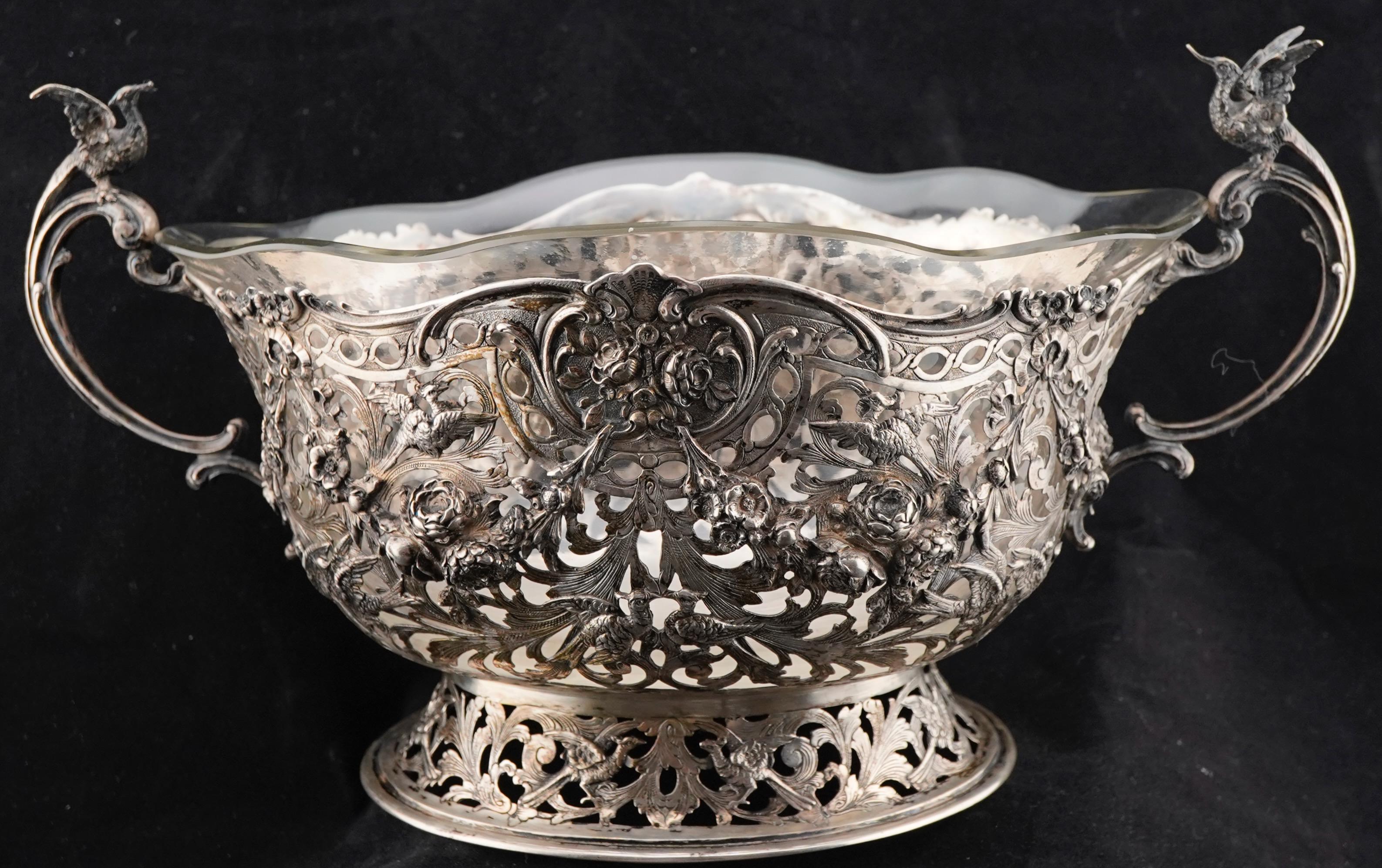 German 800 silver cast, repousse and openwork centerpiece basket with glass insert. Beautiful Baroque revival work. The basket is marked on the bottom with German silver marks. Silver weight is 1154 g  or 37.2 t. oz. 
