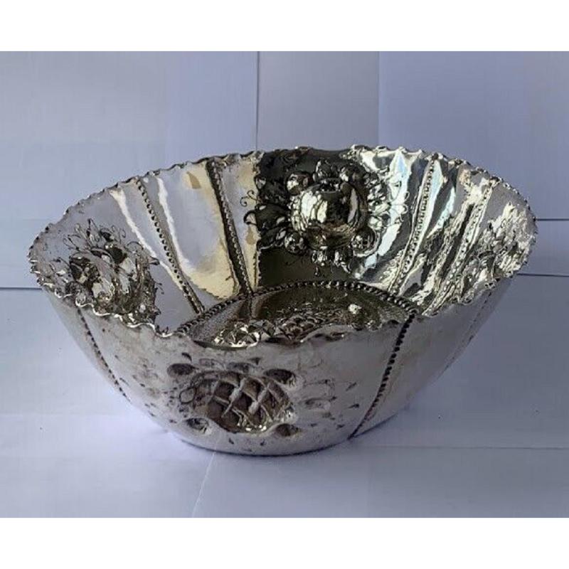 In very good condition, this bowl is beautifully decorated by pineapples, grapes, apples and oranges. This was most probably made in 1880’s.

Additional Information: 
Hallmarked: Crown and Crescent (Germany) 800. No. 9201. Made by MUNZ.
Silver