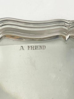 Salverino tedesco in argento con il testo "Un amico nel bisogno è davvero un amico".