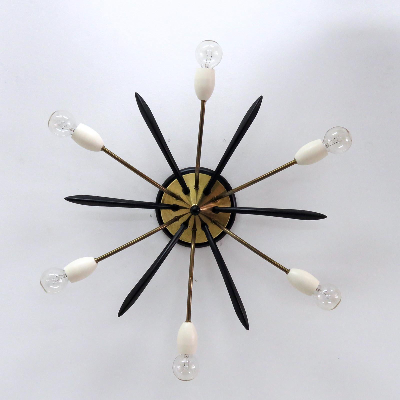 Wonderful German six-arm Sputnik fixture in brass and enameled metal can be used as wall or ceiling light, wired for US standards, six E12 sockets, max. wattage 40w per socket, bulbs provided as a onetime courtesy.