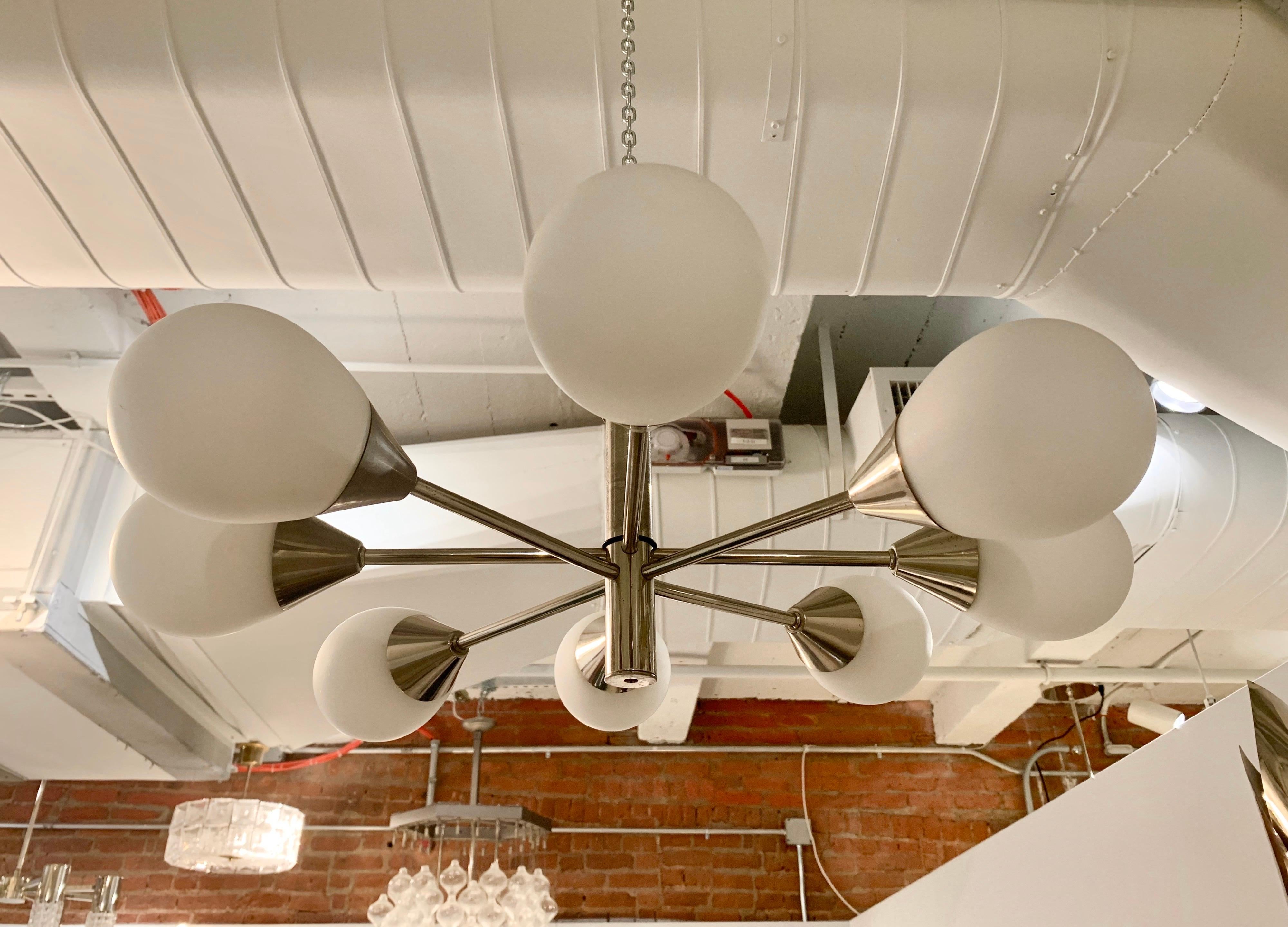 A great German 1960s wight light matte white egg globe shades with a chrome fixture. Newly rewired.