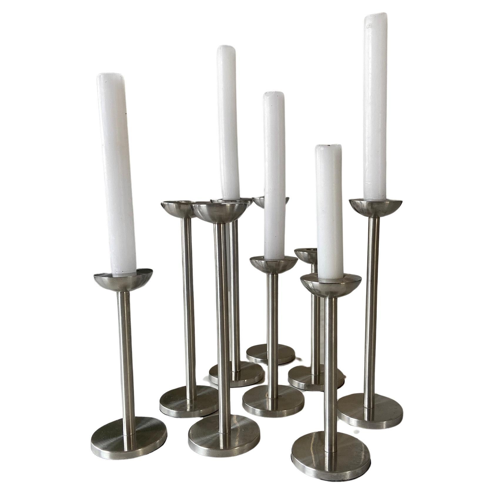 Elevate your home decor with our exclusive Stainless Steel Candle holder set, crafted in Germany this set of 9 embodies the iconic design styles of the 80s and 90s. Each piece is handmade and welded from mat stainless steel, which is a material that