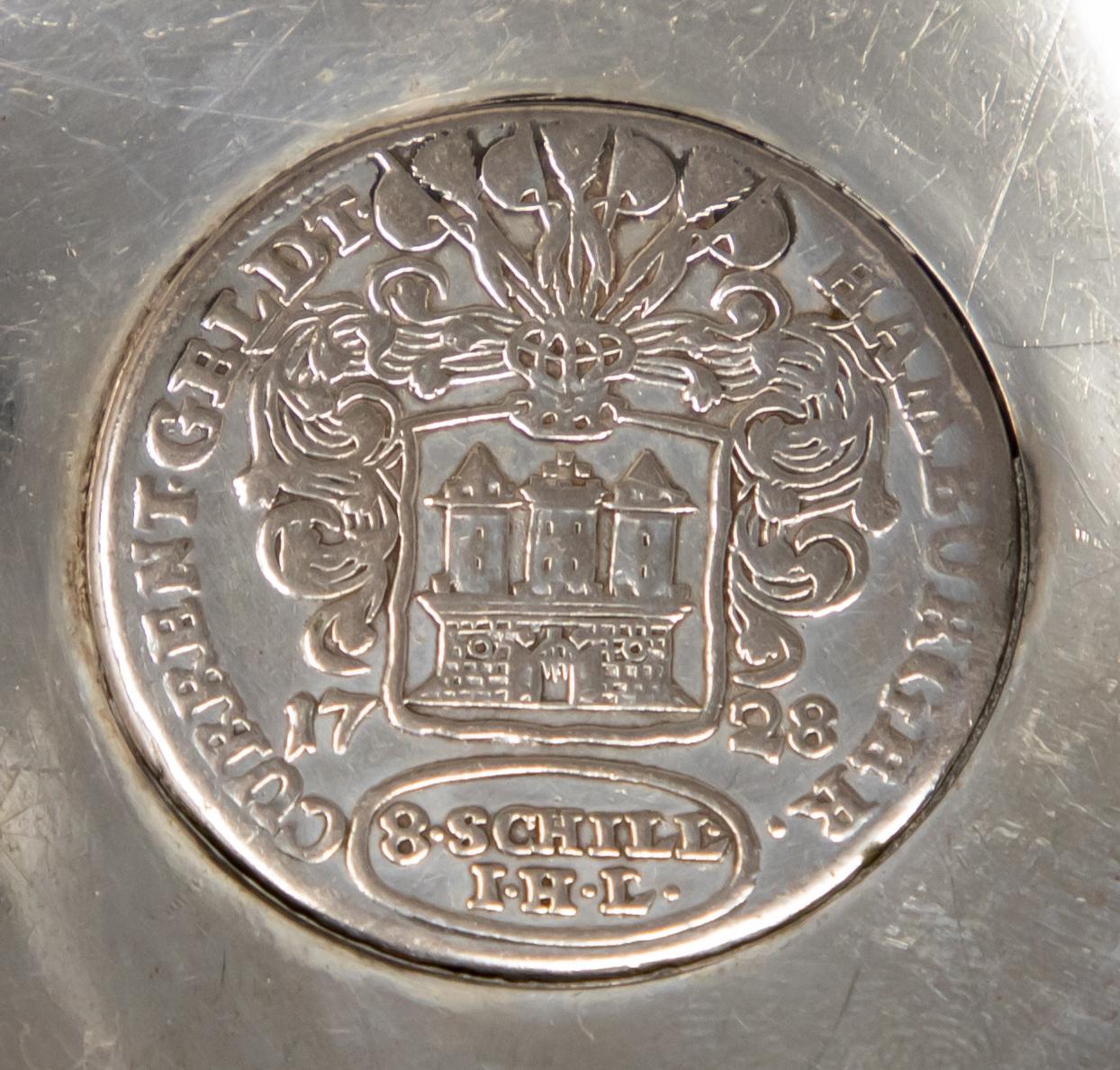 Offering this beautiful German sterling silver coin dish by Jakob Grimminger. The coin is an 8 Schill coin. The back of the dish is marked with a half moon and crown, 835, and the letter G inside a star which is the mark of Jakob Grimminger,