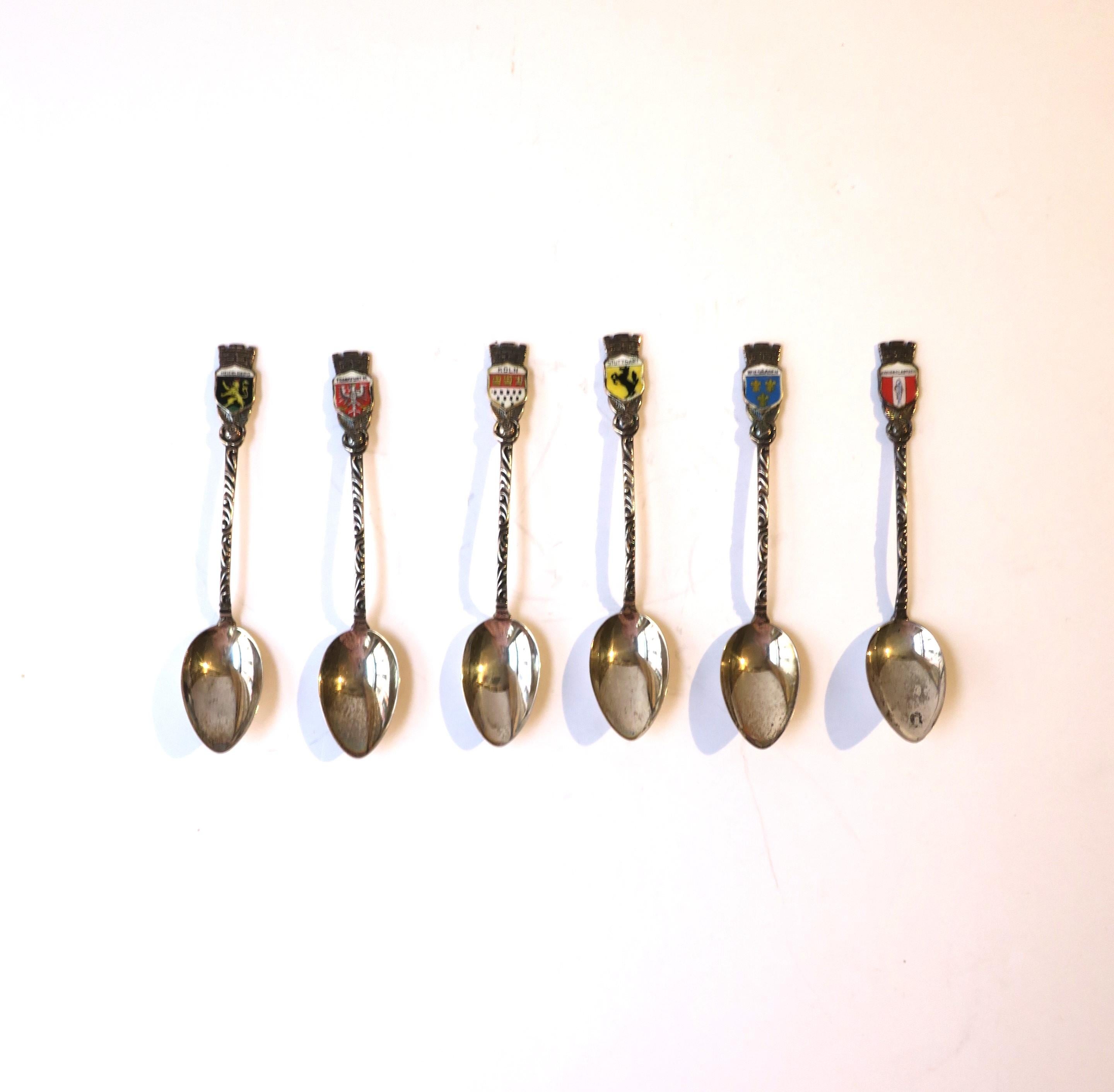 A set of six (6) German sterling silver espresso coffee or tea demitasse souvenir spoons with crest design, circa early to mid-20th century, Germany. Each crests represents a different town in Germany. Spoons are marked on back 'Sterling'. Spoons