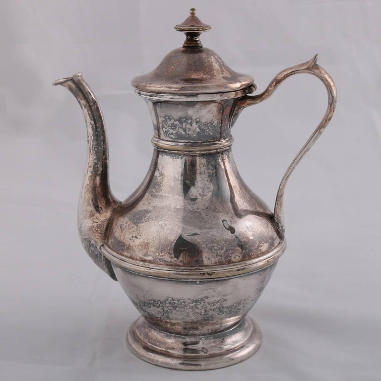 German sterling silver hallmarked Georgian Style tea pot features hourglass form with scroll handle, touch marks on base include rampant lion, possibly Darmstadt, 12.6 toz, 19th Century
  
Measures: 8