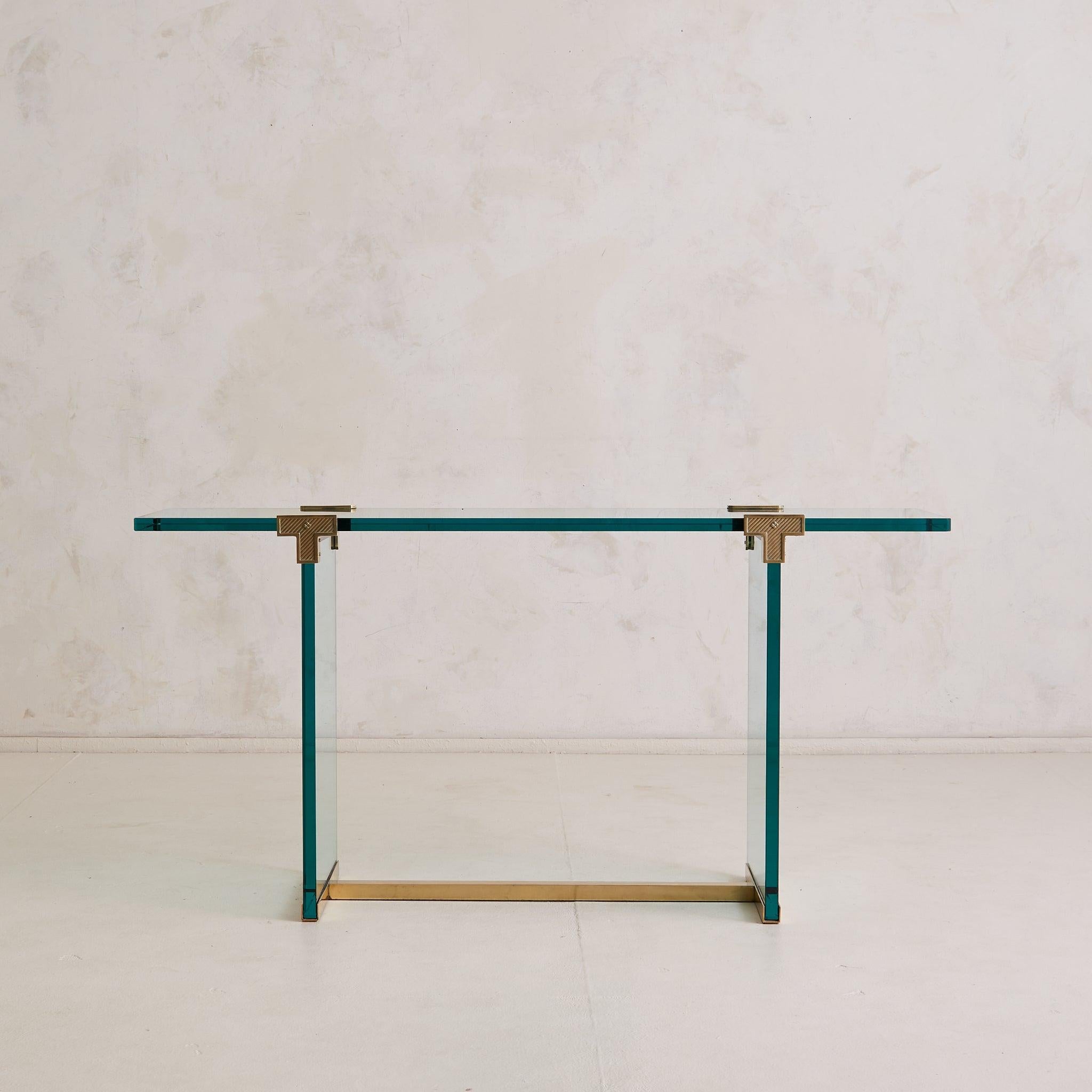 The 'T30' console by German designer Peter Ghyczy distills 1970s modernism to its purest form. Composed of rare triple-thick plate glass in a soft aquamarine tint, the table appears to hover—weightless and architectural—its top plane suspended