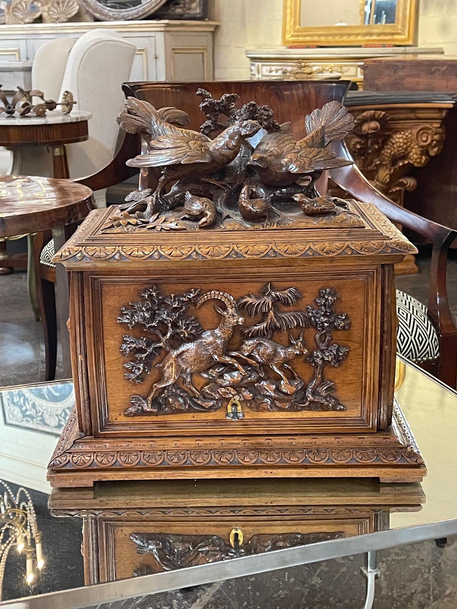 19th century German Black Forest carved oak tantalus set, Circa 1870. This is a nicely carved set. A complete set of stemware with this piece.