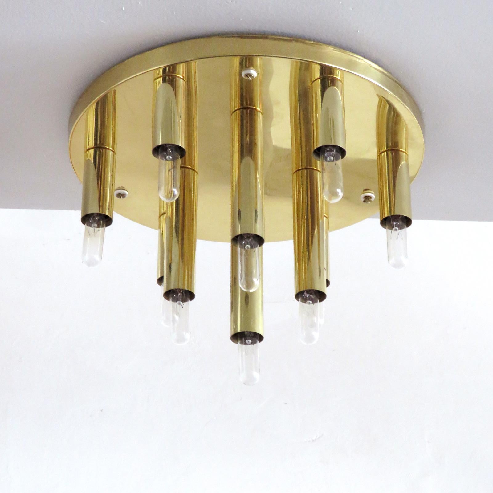 Stunning circular ten-light flush mount light panel in brass by Soelken Germany, can be used as wall light as well