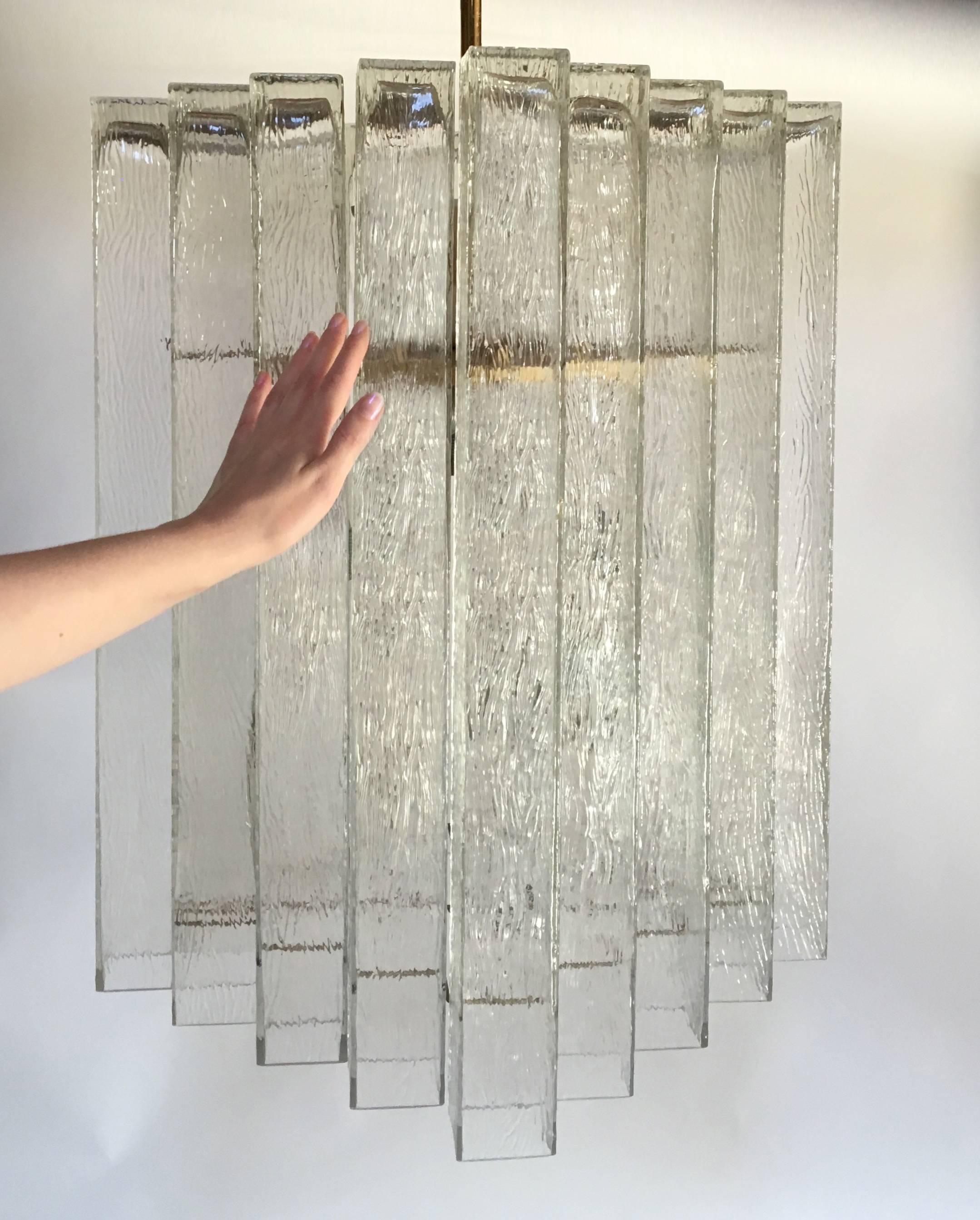 A chandelier consisting of multiple rectangular textured glass hung on a brass frame by Doria Leuchten, German, 1960s (two available).