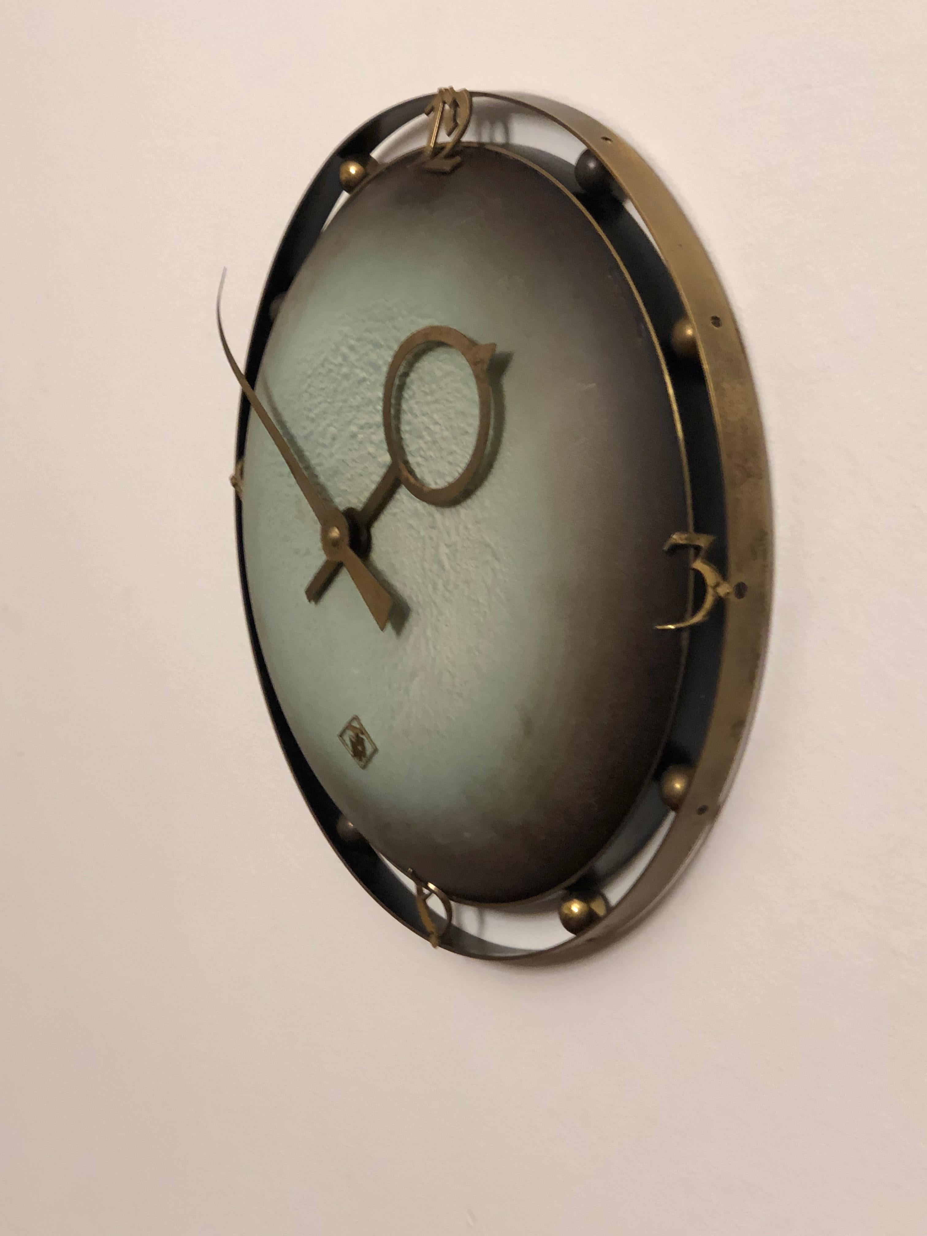 Brass frame and brass hands made by TN Telenorma in the late 1960s.
Formerly an office or factory slave clock, it is now fitted with a modern quartz movement with a battery.
 