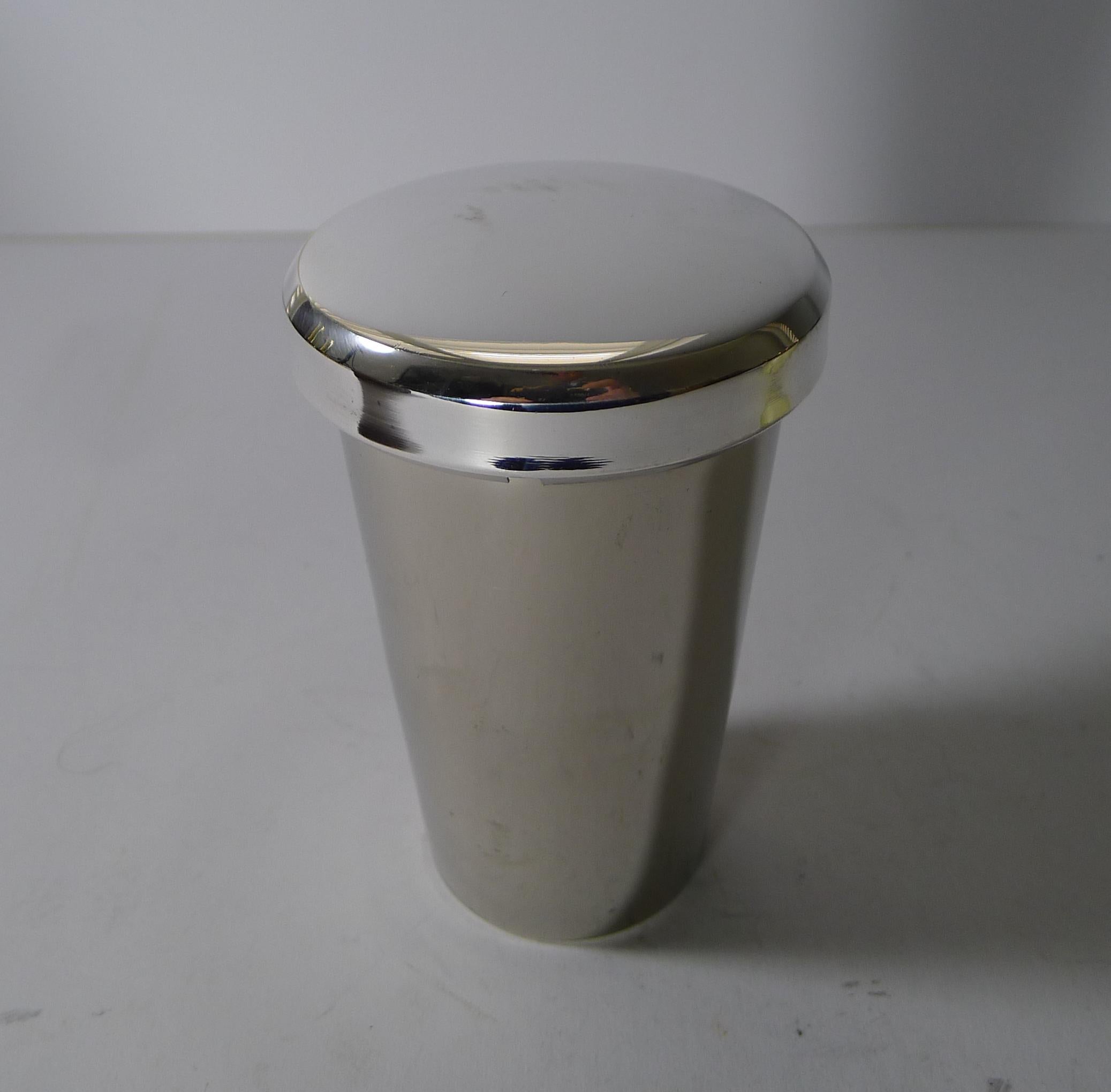 A charming antique German campaign cocktail shaker made from silver plate dating to the Art Deco era, c.1930. The set comes complete with it's original leather case in good condition.

The silver plated case opens to reveal the inside of the top