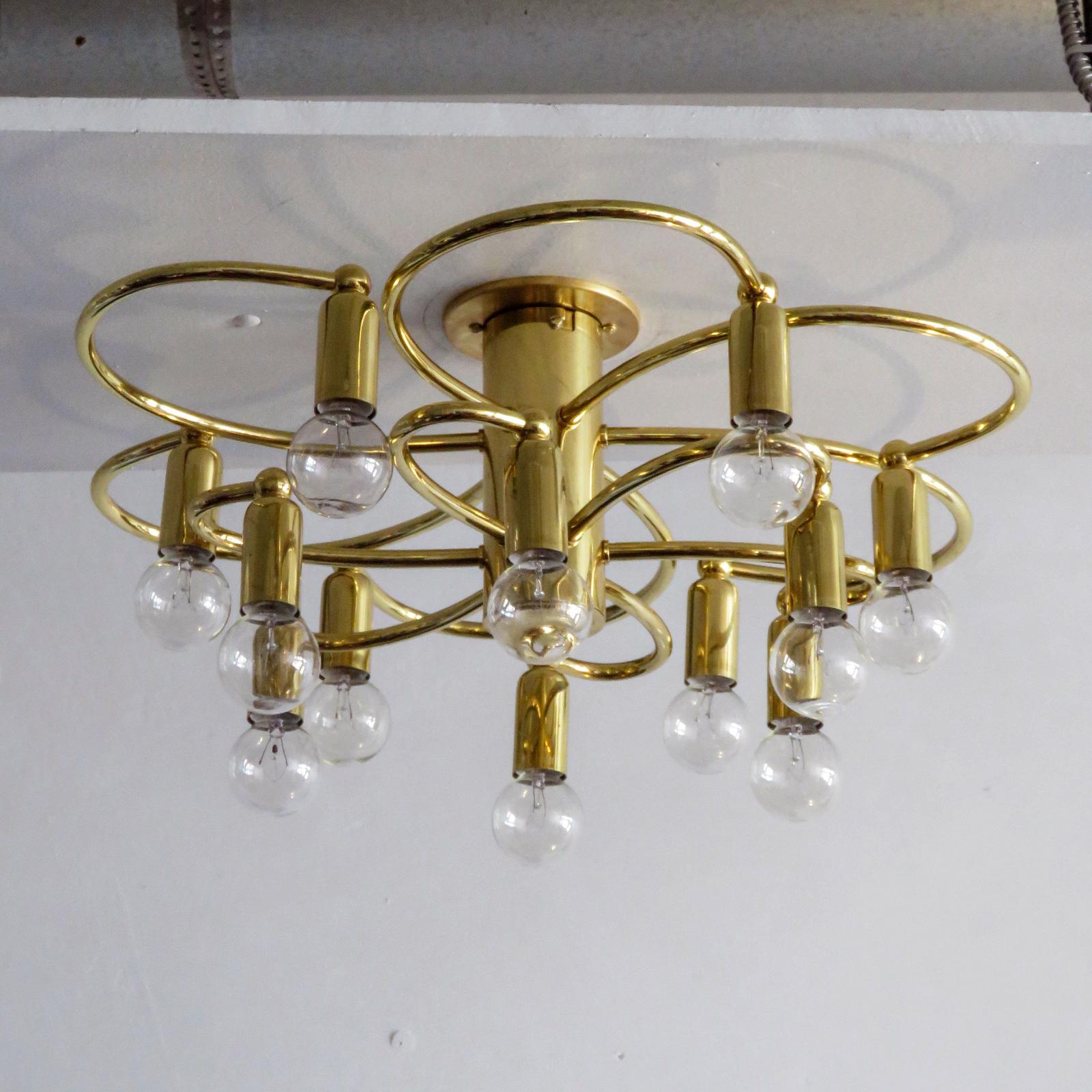 Stunning brass twelve-light flush mount ceiling light by Honsel, Germany with two tiers of six organically shaped arms, with a total of 12 sockets total, can be used as wall sconce as well, wired for US standards, twelve E12 sockets per fixture,