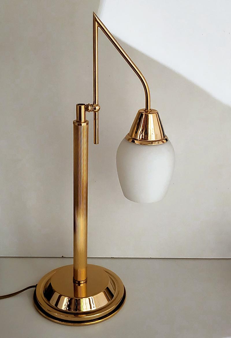 Beautiful adjustable brass and white glass table light.
Germany, 1970s.
