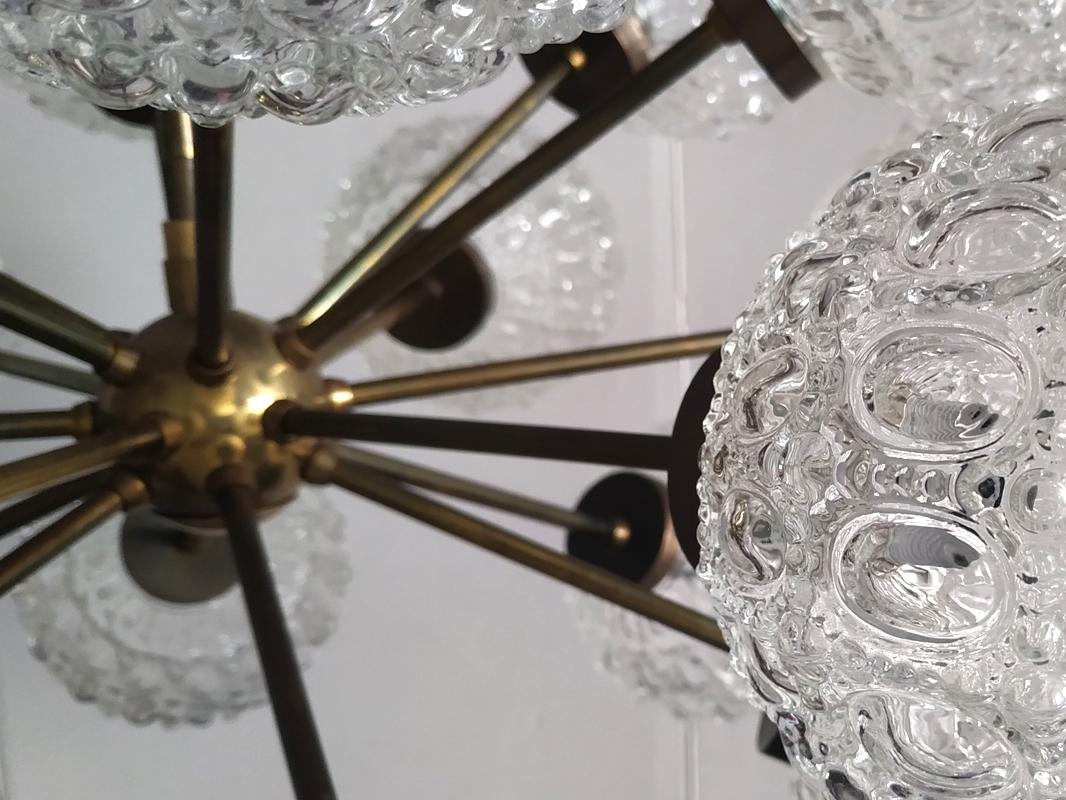 Beautiful 18-arm geometric clear glass and brass Sputnik chandelier.
Germany, 1960s/1970s
Measures: 
Diameter: 26 Inch
Height min. (body): 16 Inch.
 