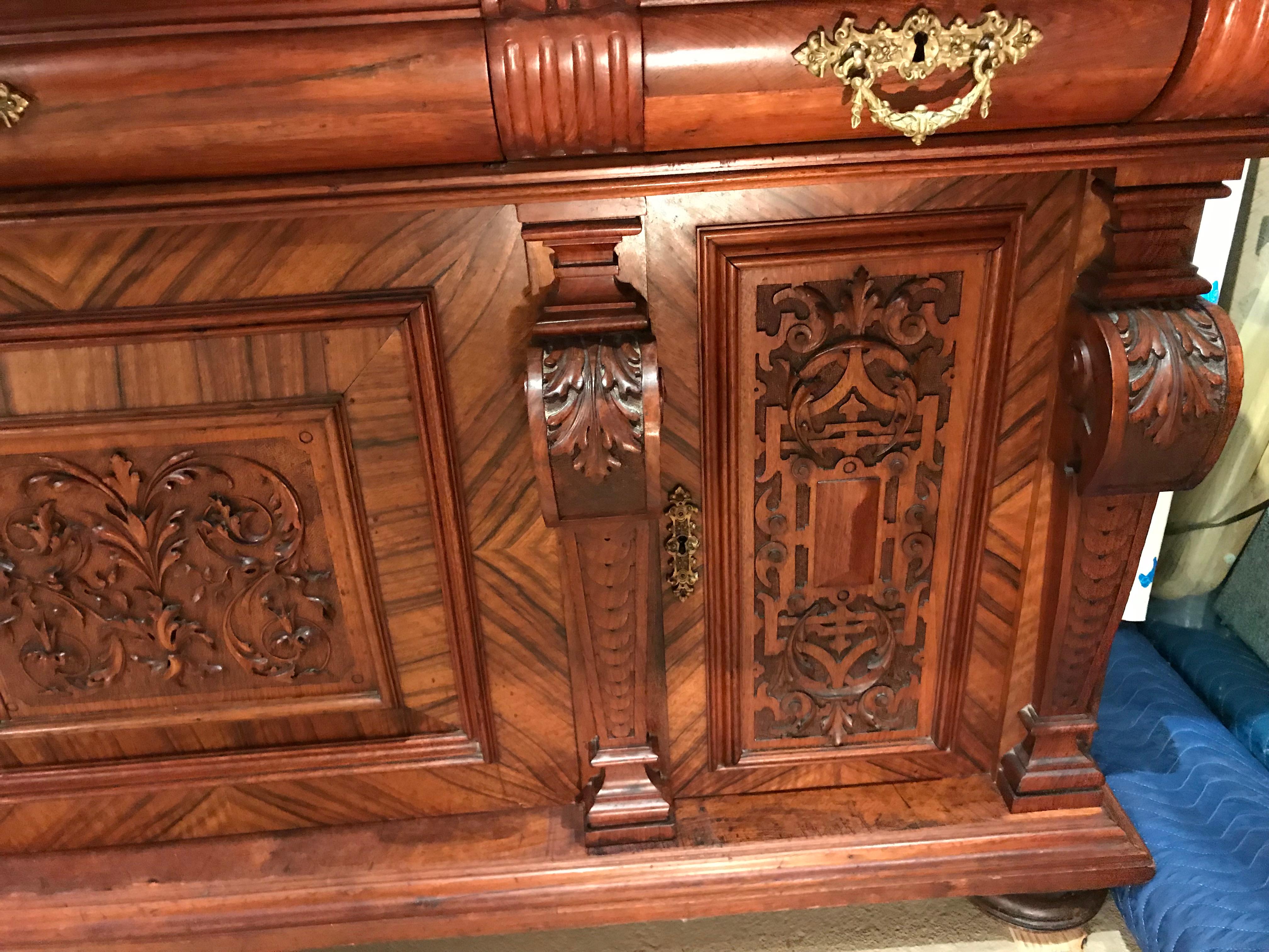 Hand-Carved German Walnut Schrank or Cabinet with Boldly Carved Panel Doors
