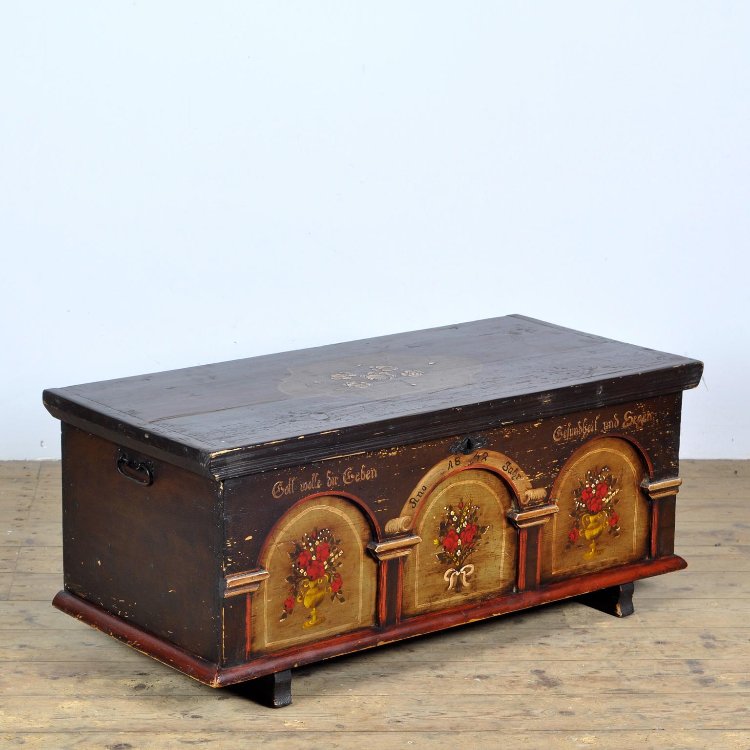 Picturesque German dowry chest made in 1842. These chests were typically part of a young woman's dowry, filled with her linen and silver to move to her new home after marriage. Hand painted with lovely fine details. With the original lock and key.