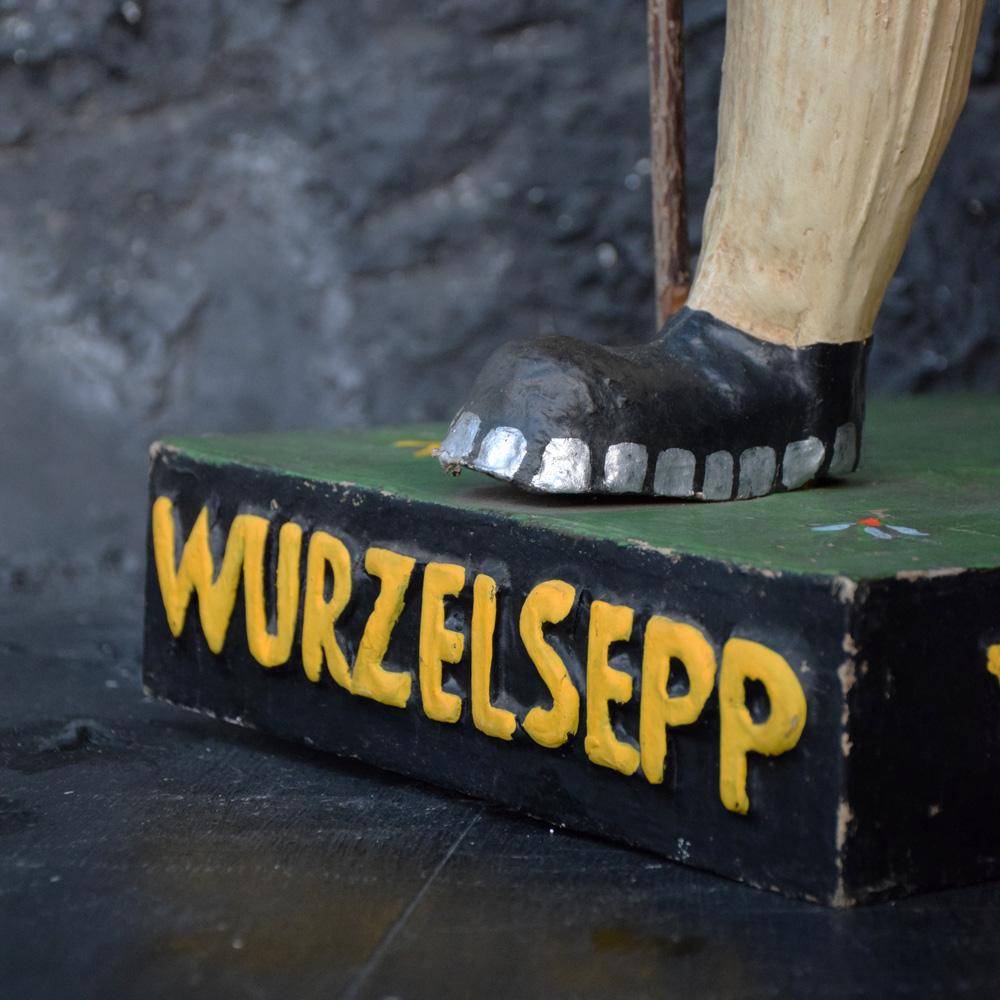 A rare mint condition for its age Wurzelsepp papier mâché advertising figure, circa 1930. Hand crafted figure with detachable had and walking stick which is made from a real branch. These examples do come up from time to time, however not in such