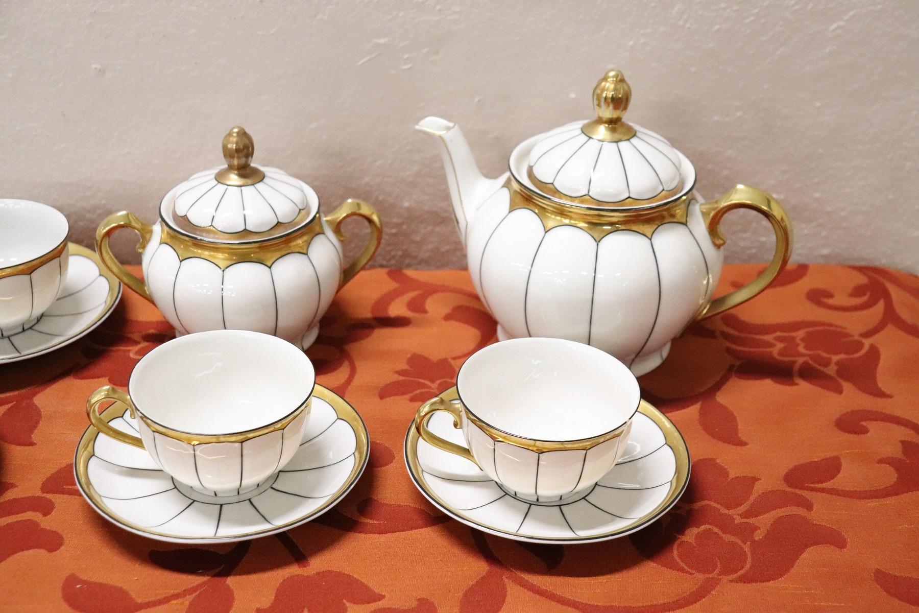 Beautiful fine white porcelain teaset 15 pieces signed Schaller, circa 1940s. The service is complete to serve six people at the table includes: 1 teapot, 1 sugar bowl, Six cups with saucers for tea. Refined decoration with gold borde. High quality