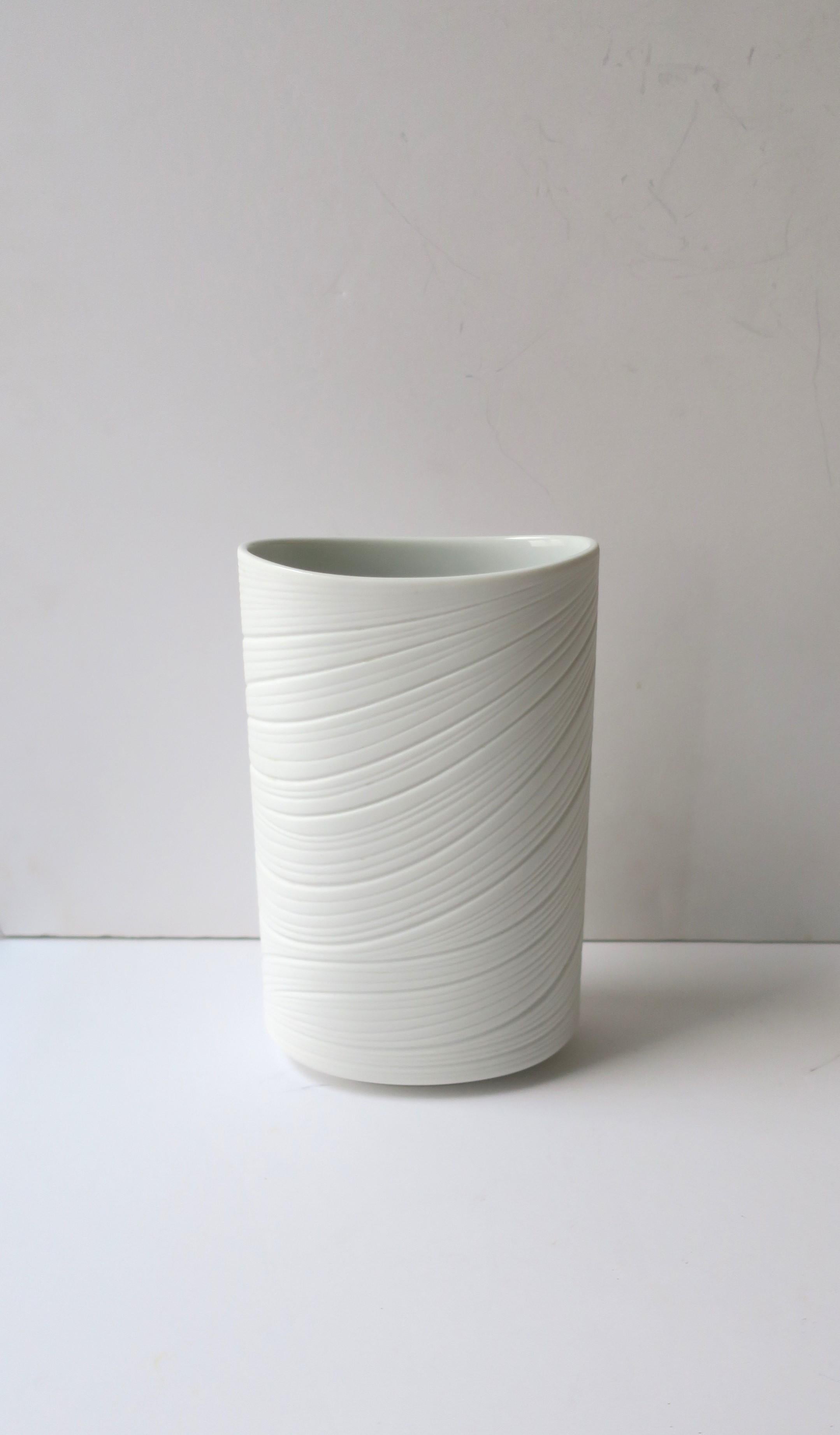 A German white matte porcelain vase by Rosenthal Studio-Line Collection, circa late-20th century, Germany. Oval in shape with organic modern design on around - front, side and back. Maker's mark on bottom as shown in last image. Beautiful with or