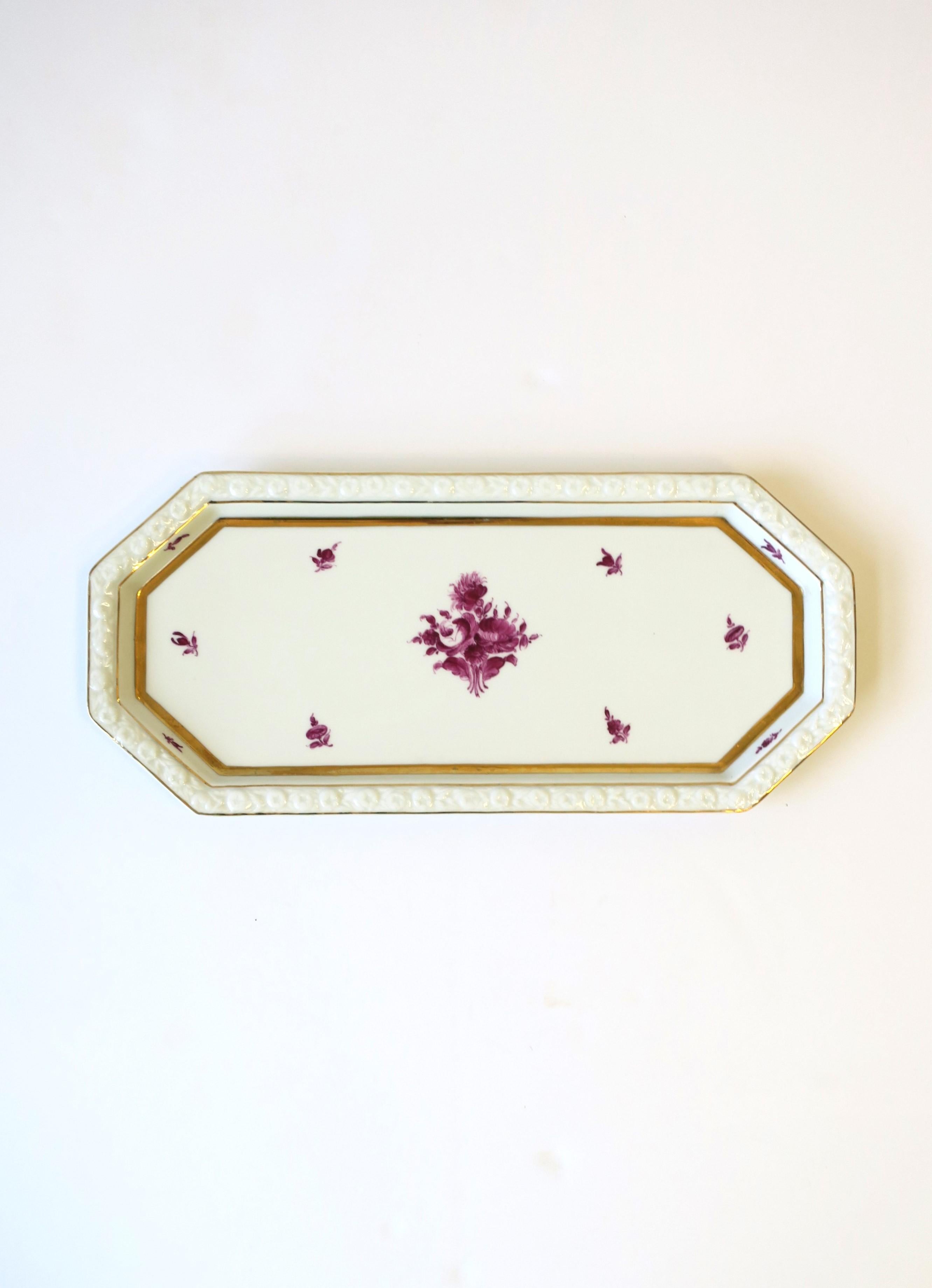 A German white porcelain serving (or vanity) tray with hand-painted floral design and gold detail, circa mid to late-20th century, Germany. Tray is oblong/octagonal and can serve cuisine or work as a 'vanity' tray as demonstrated. Tray is