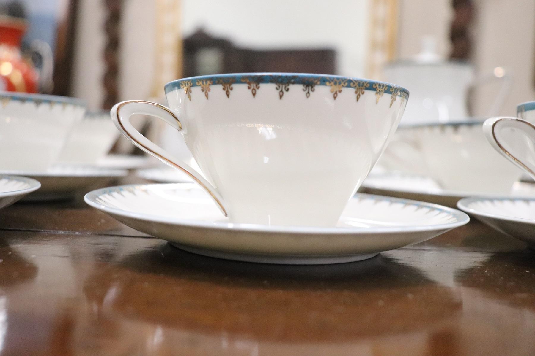 Beautiful fine white porcelain tea set 27 pieces signed Bavaria, 1980s. The service is complete to serve twelve people at the table includes: 1 teapot, 1 1 sugar bowl, 1 milk jug, twelve cups with saucers for tea. Refined decoration with blue and