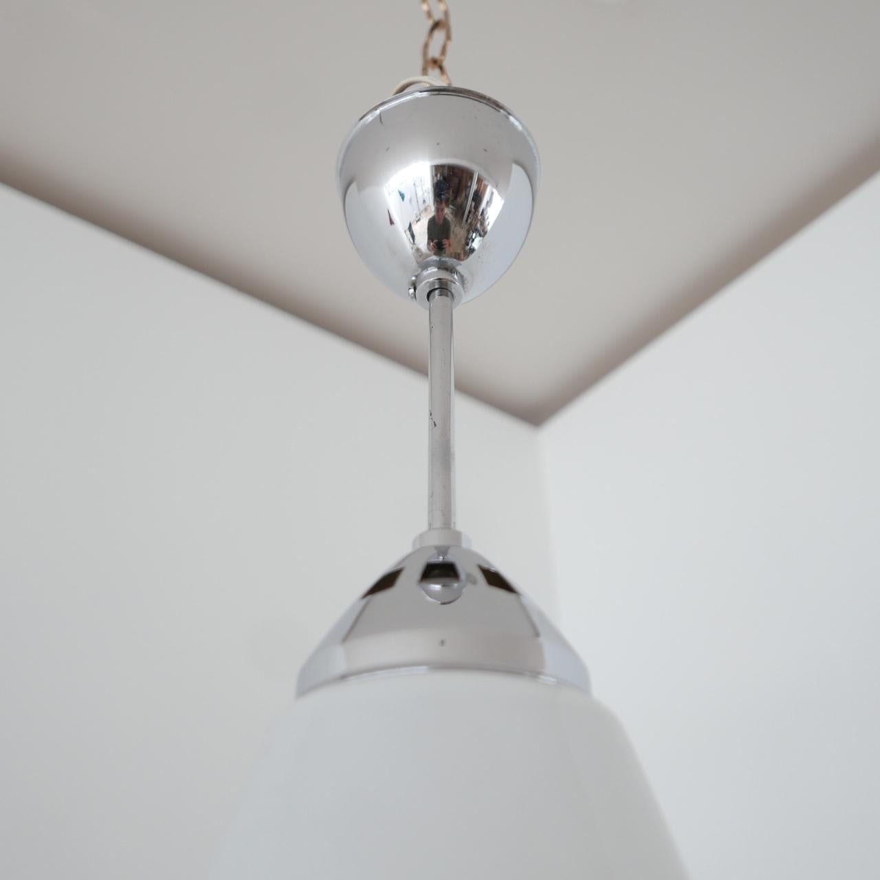 A scarce pendant light by Zeiss Ikon.

Mirrored glass removable shade sits over an opaline pendant.

Labelled Zeiss Ikon.

Re-wired and PAT tested.

Dimensions: 38 diameter x 50 height in cm.

Delivery: POA.

 