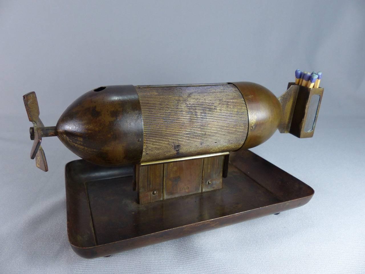 Rare and unusual German zeppelin torpedo bomb cigarette dispenser cigar cutter. Predates the highly collectible and most famous zeppelin and airplane cocktail shakers manufactured in the 1930's by the German company with the letters DGR, which also