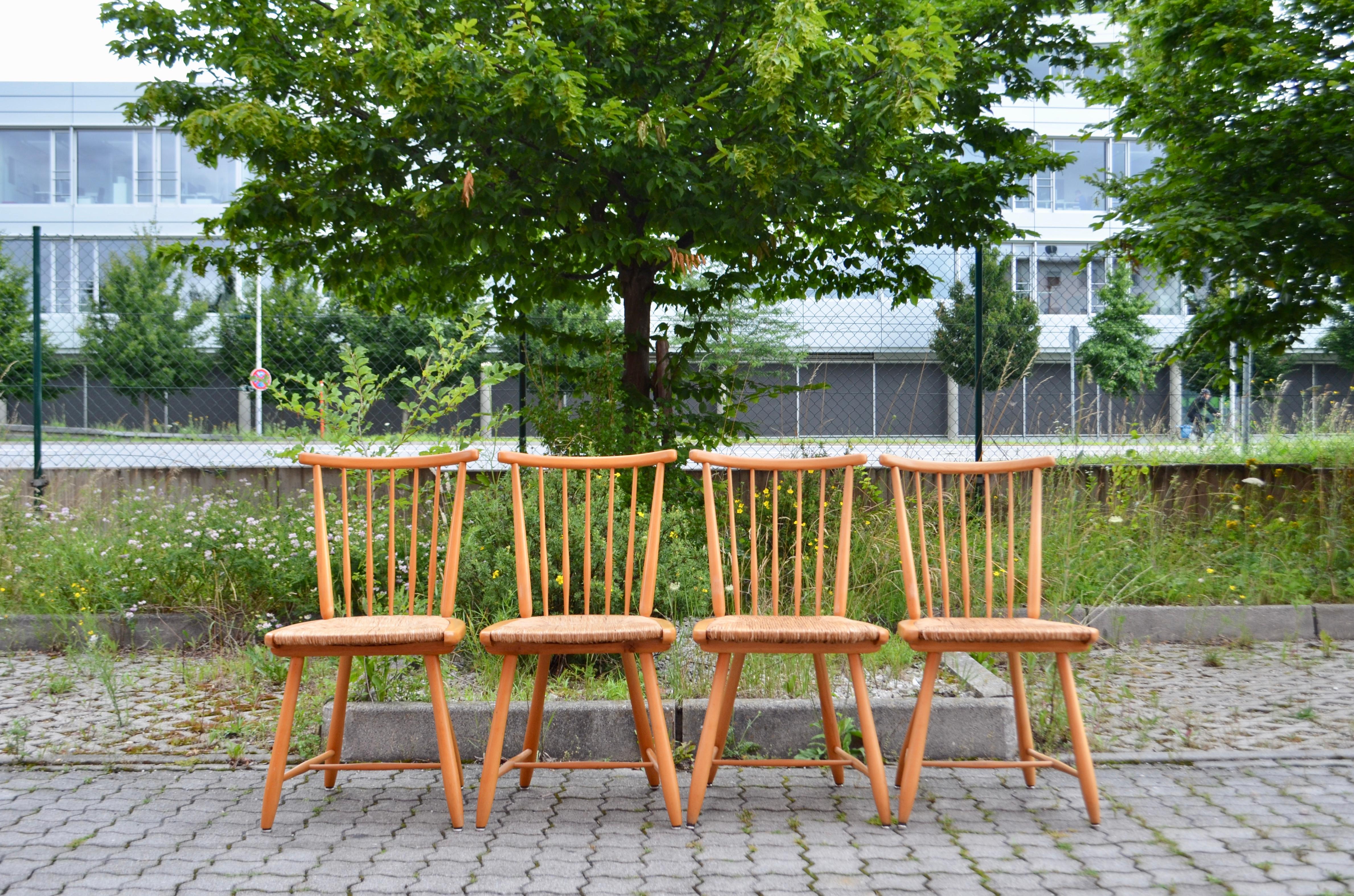 Dining chairs designed by German architect Arno Lambrecht for WK Möbel.
From the WKS Series.
Made of beechwood and Papercord.
From the Shaker movement inspired design.
Set of 4 chairs.