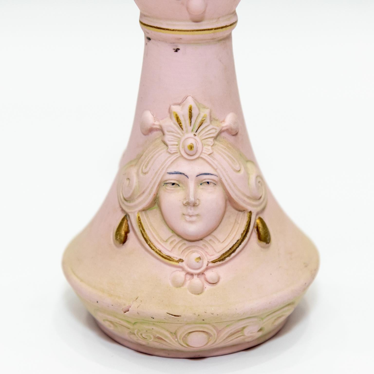 Circa early 20th century porcelain hat pin holder which bears the mark of Schafer and Vater from Germany. The piece depicts a woman in an Art Nouveau design as seen on the base. Made in Germany. Please note of wear consistent with age including