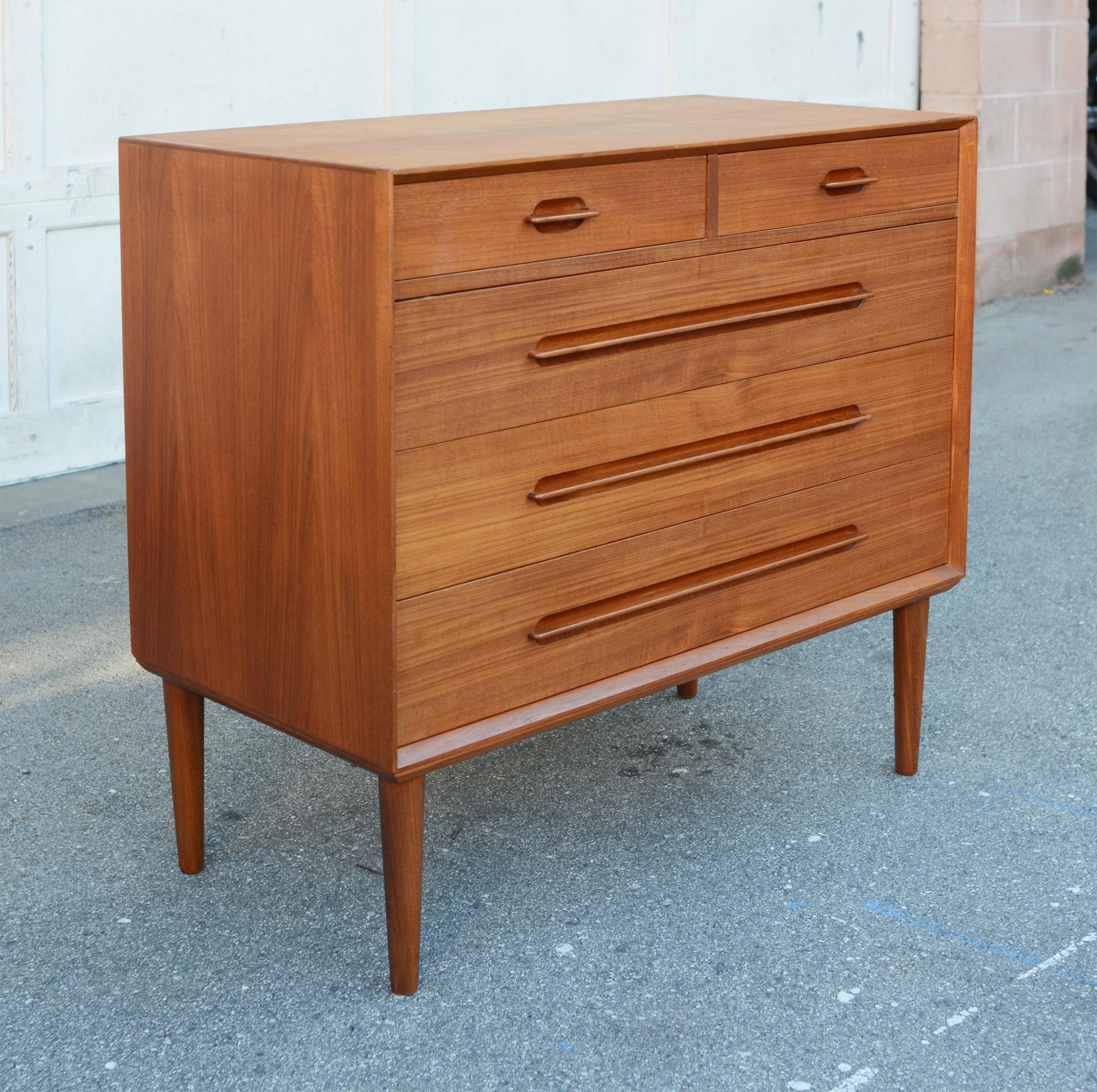 Small chest of drawers designed by Ejvind A. Johansson for Gern Mobelfabrik. The five drawers feature an unique handle design. This has been cleaned and oiled and the top lightly refinished.