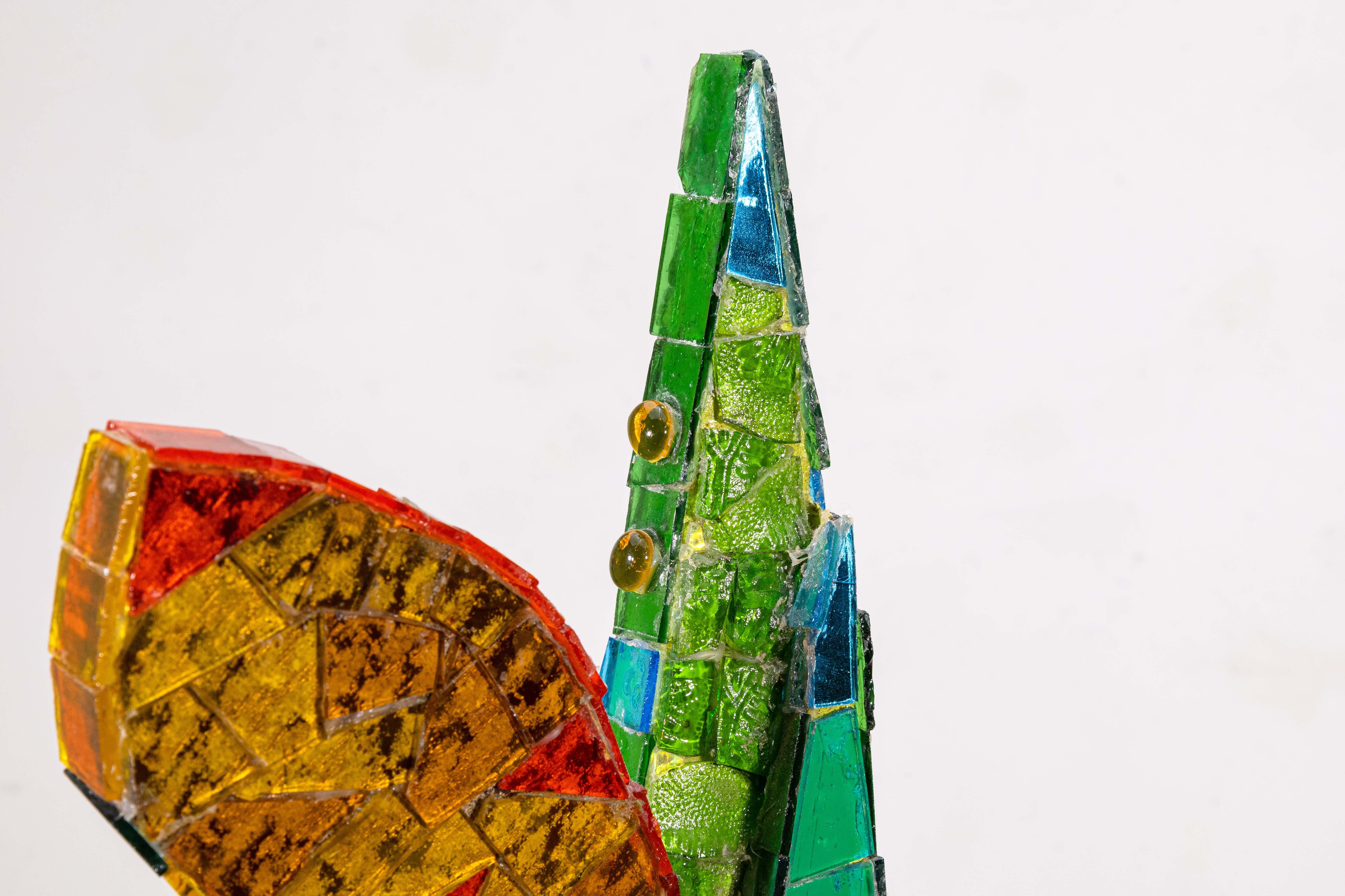 A contemporary mosaic on wood sculpture Untitled (Mosaic Study) by Gerome Kamrowski. Hand signed on sculpture. Circa 1980s. A surreal composition of an abstracted winged figure. Provenance: Alice Simsar Gallery, Ann Arbor. Dimensions: 22”h x 21”w x