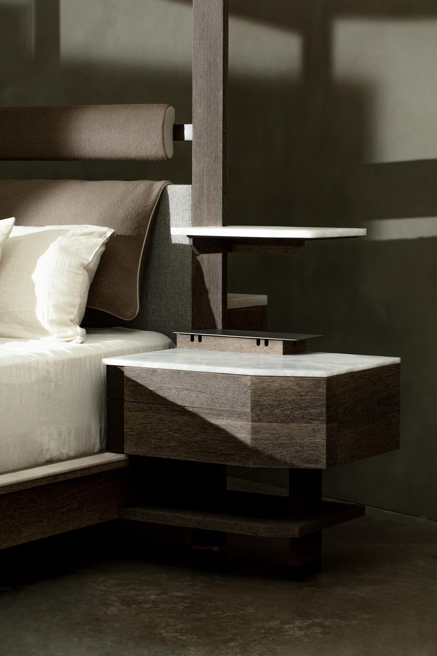 Crafted from fine wood, the Gerrit bed boasts an adjustable fabric pergola for customizable privacy, leather upholstery for refinement, and reading lights for enhanced functionality. With integrated bedside tables featuring hidden power outlets, the