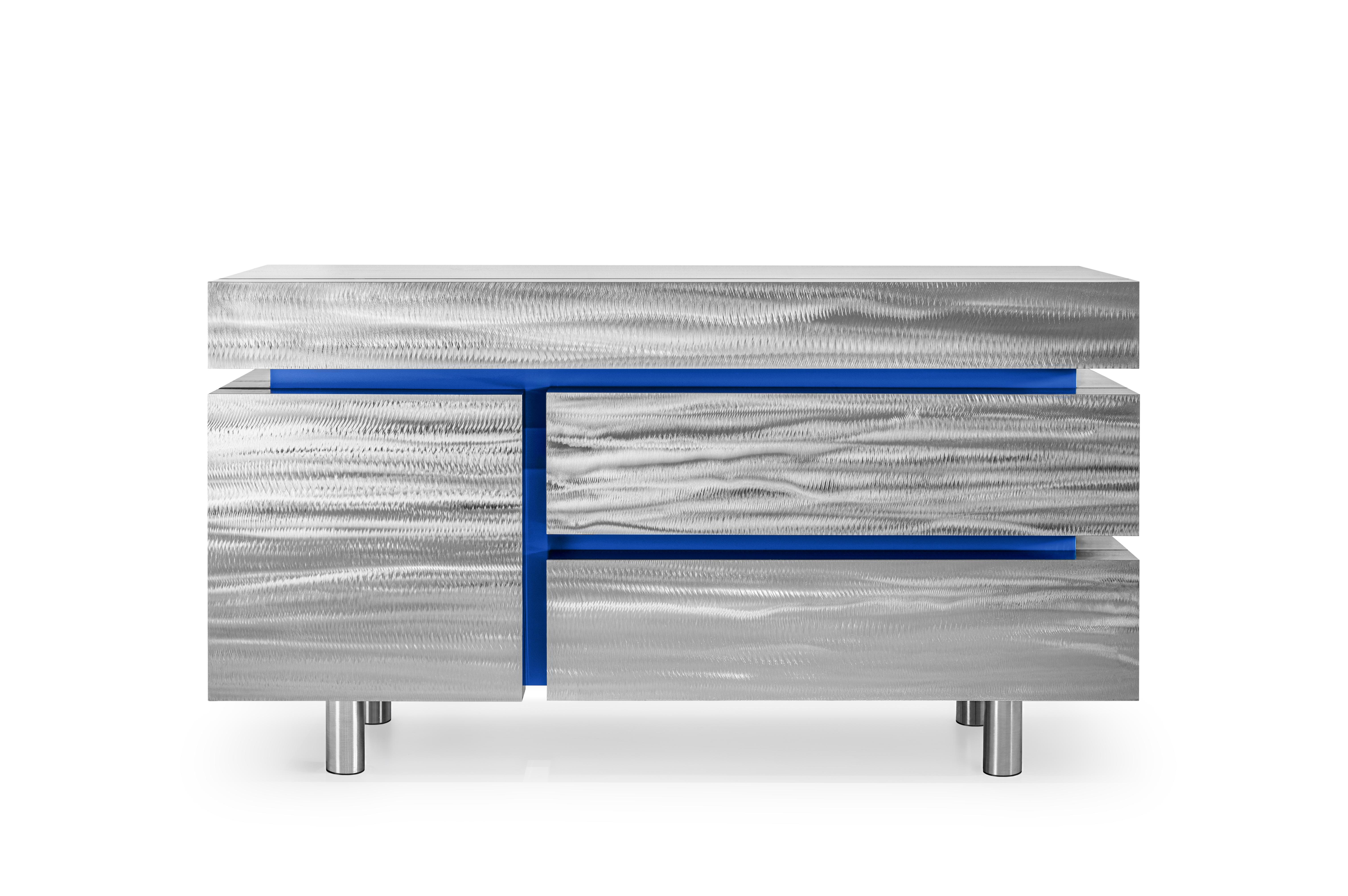 Gerrit CS1 Sideboard Limited Edition of 12 by NOOM
Dimensions: W 140 x D 50 x H 80 cm 
Materials: Stainless steel, MDF. 

The metal sideboard has four drawers and is contemporary, massive, and elegant at the same time. This is a kind of