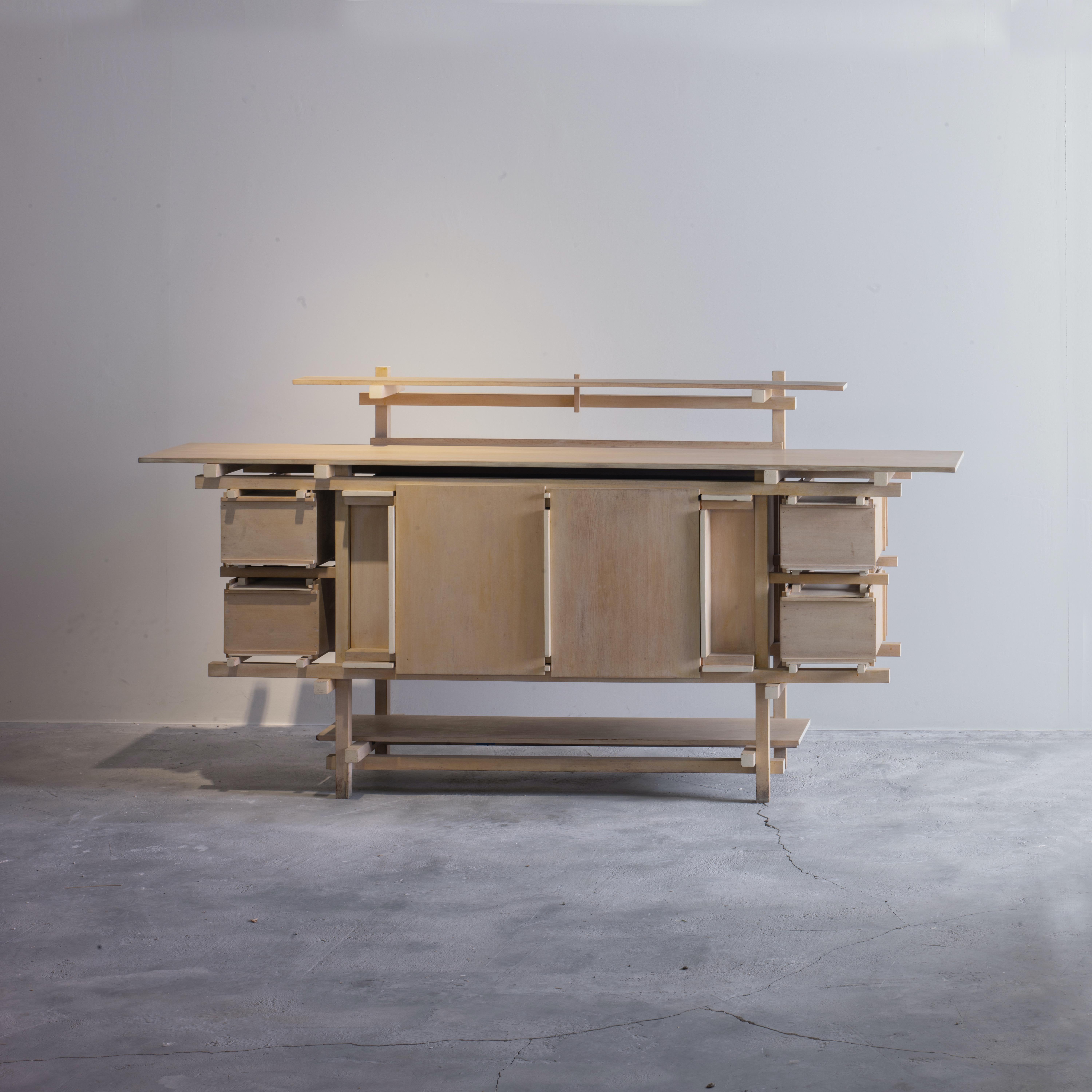 Sculptural qualities define this object. Its form is a combination of solid shapes and negative spaces in an expressive dynamic. The relationship between them ensures a balanced composition. The careful alignment and proportions create an
