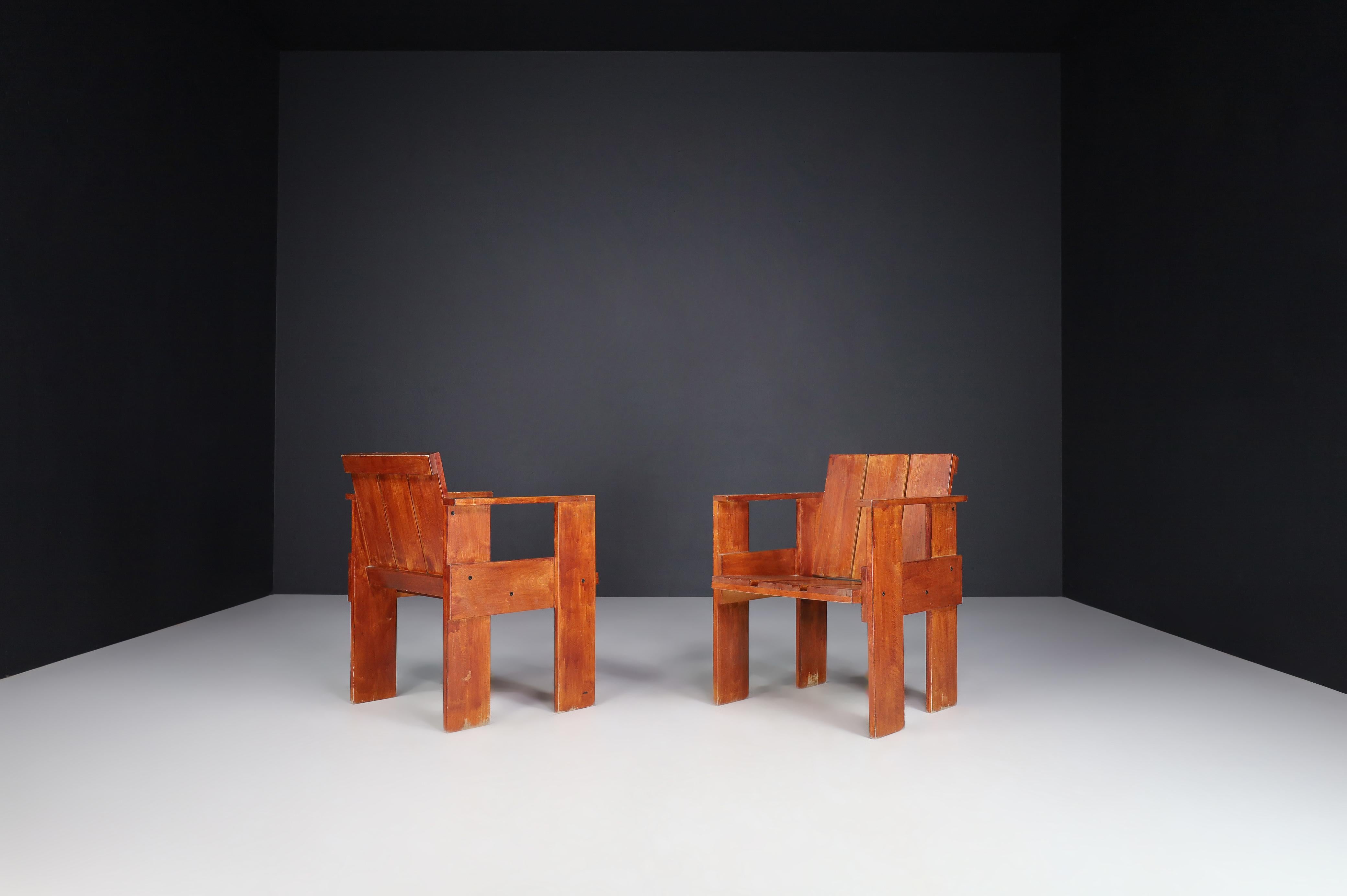 Gerrit Rietveld for Cassina crate chairs, Italy 1970s.
 
Pair of two Gerrit Rietveld' Crate' chairs. These chairs were designed in 1934 and produced by Cassina in the 1970s. These chairs are made out of ash wood and have patinated stained lacquer.