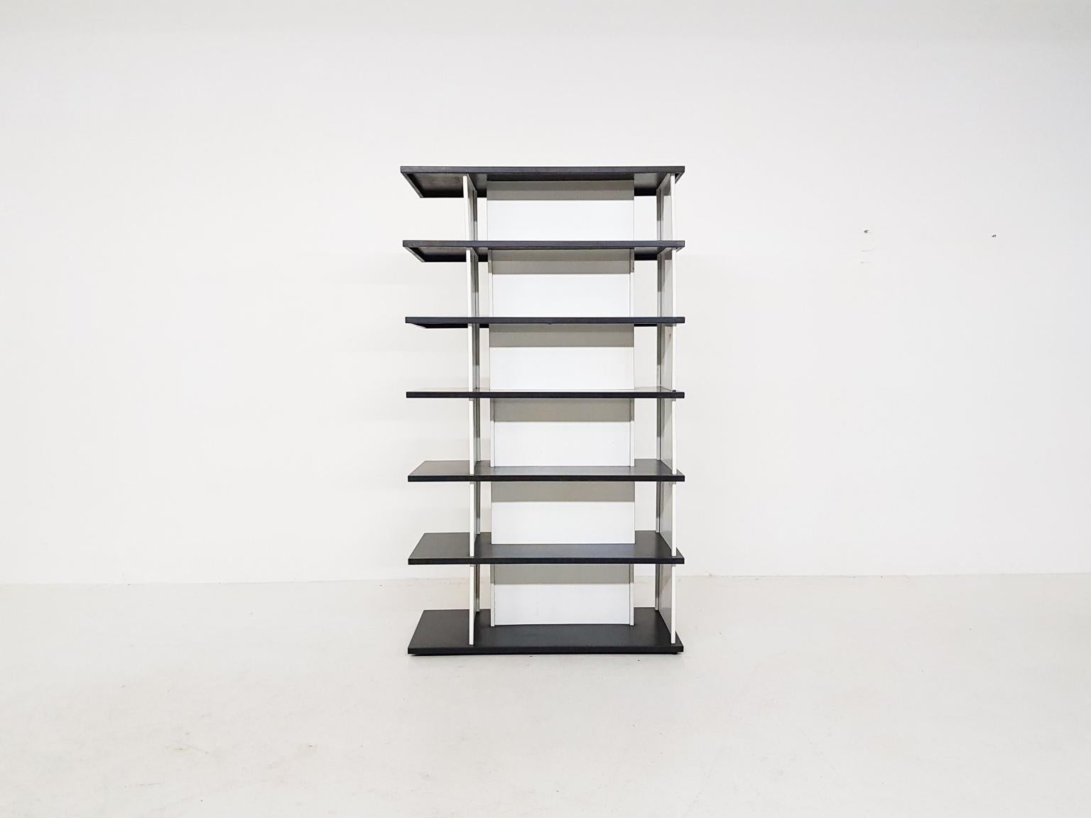 Dutch minimalistic metal room divider or bookcase by Wim Rietveld, the son of Gerrtit Rietveld. It was designed for “De Bijenkorf” the Netherlands in the 1960s and was inspired by a model designed by Gerrit Rietveld.

This bookcase or cabinet is a