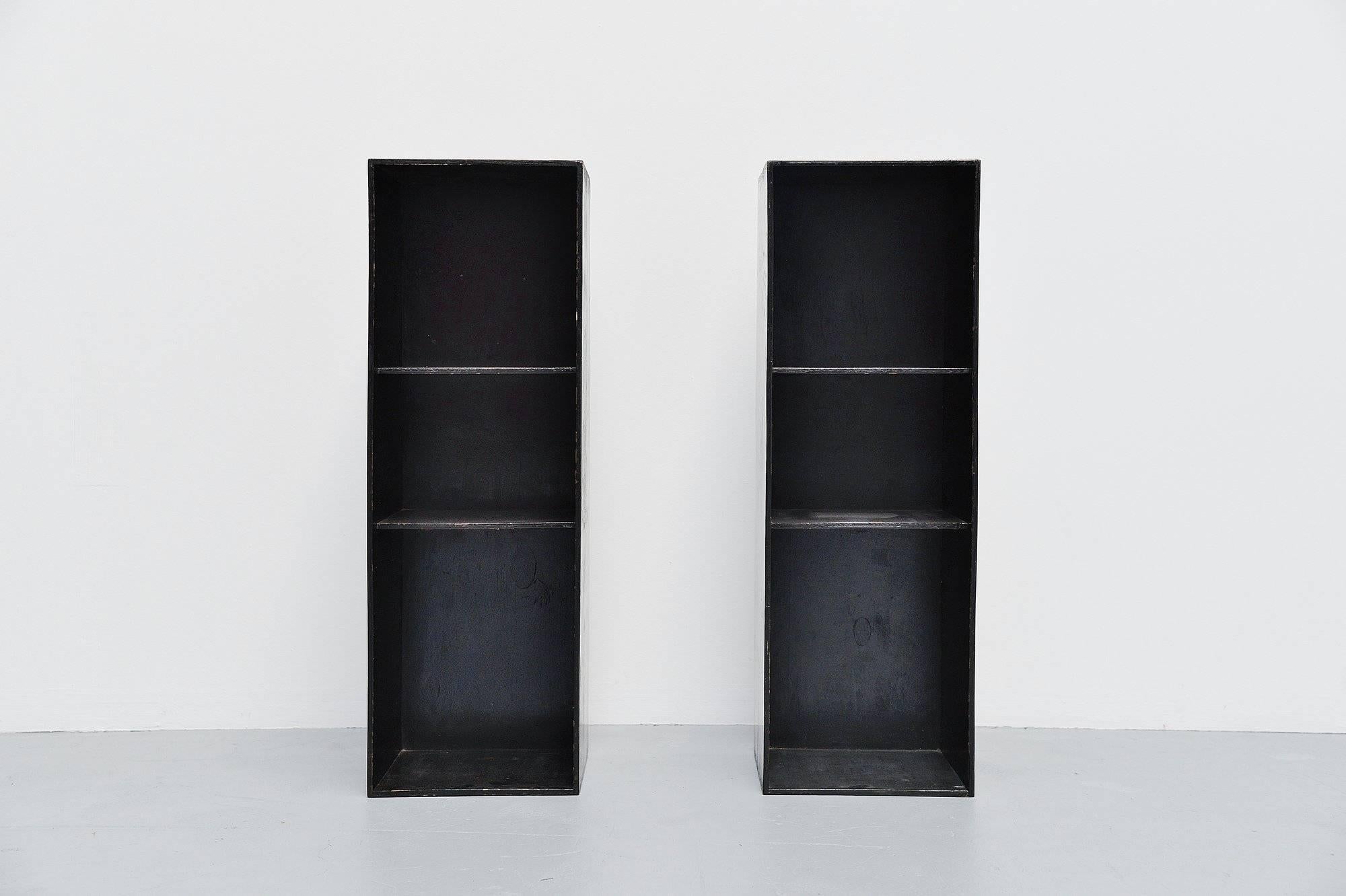 Modernist pair of cabinets from a modular system designed by Gerrit Rietveld with help of Truus Schroder, Holland 1935. These two cabinets come from a set of nine purchased by the family in 1935. Originally the cabinets had a black outside and red