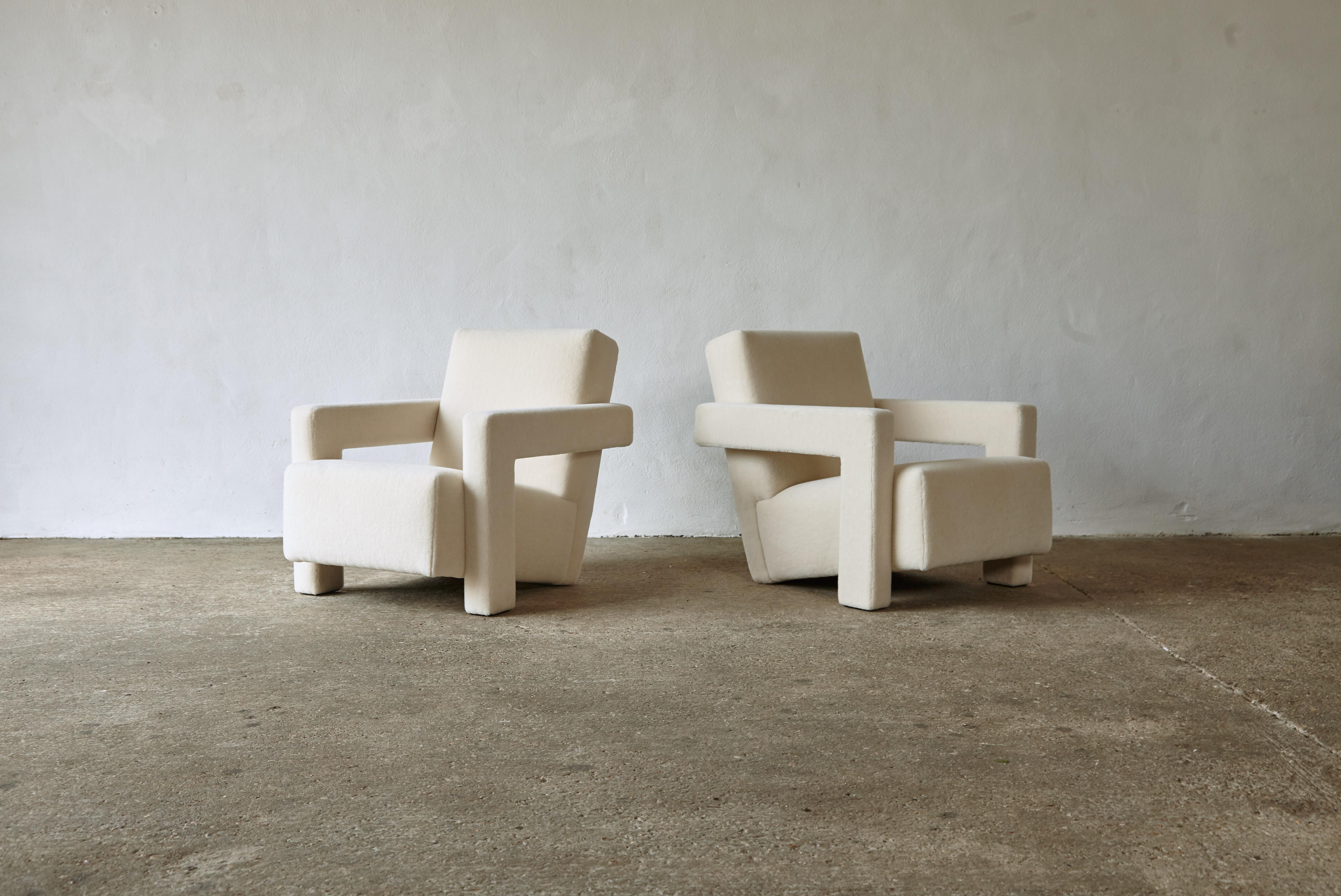 A pair of Gerrit Rietveld Utrecht armchairs, produced by Cassina, and newly upholstered in an off-white / cream thick, soft, luxurious 100% alpaca pile fabric. Cassina labels to the underneath. Priced and sold as a pair together. Fast shipping