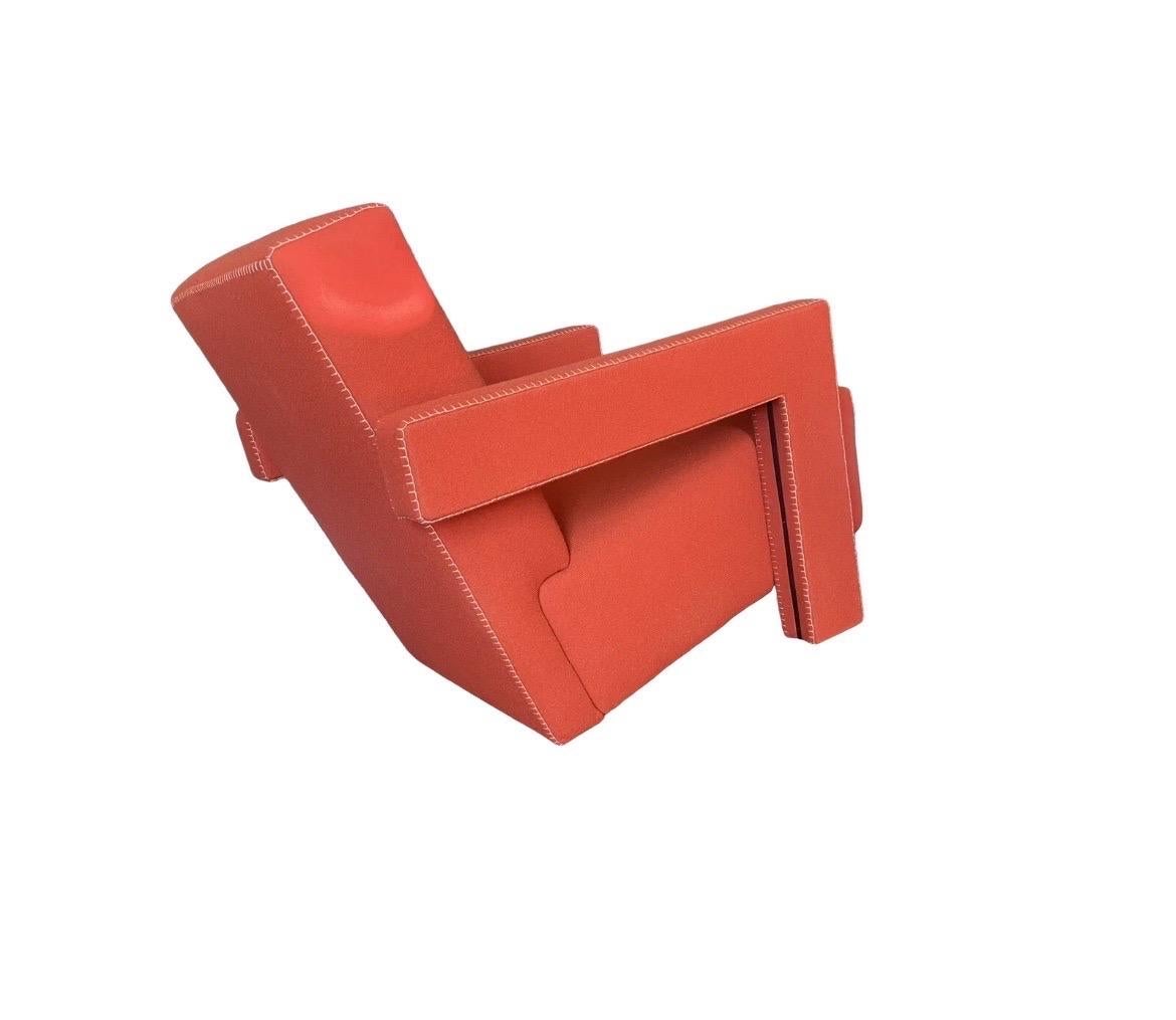 Cassina edition of classic armchair. This example for sale is a red/orange color.  Excellent condition. 

Combining experimentation and comfort, Gerrit Thomas Rietveld designed this renowned design armchair in 1935 for the Metz & Co department store