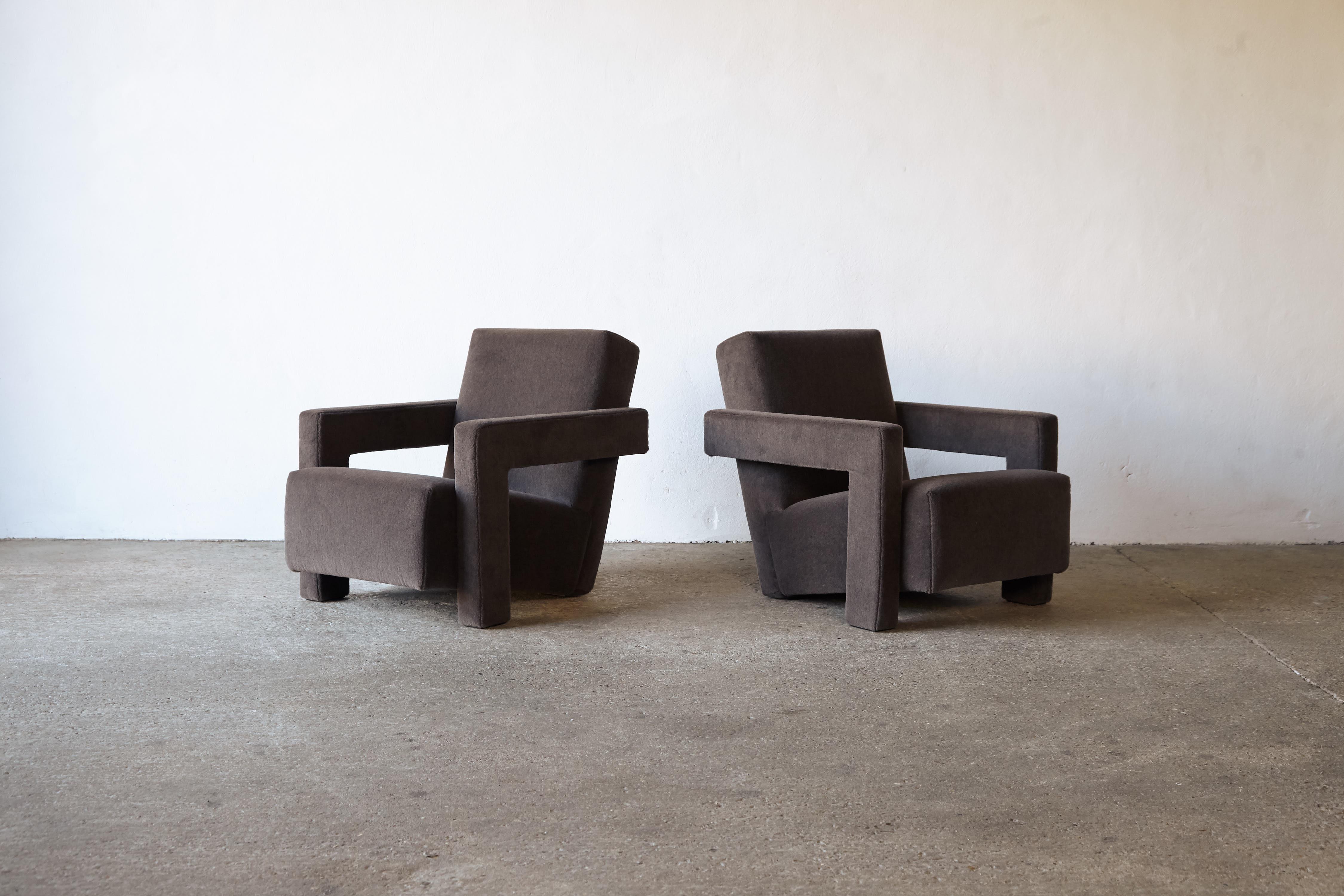 A pair of Gerrit Rietveld Utrecht armchairs, produced by Cassina, and newly upholstered in a soft, brown/grey premium 100% alpaca wool fabric. Cassina labels to the underneath. Priced and sold as a pair together. 






