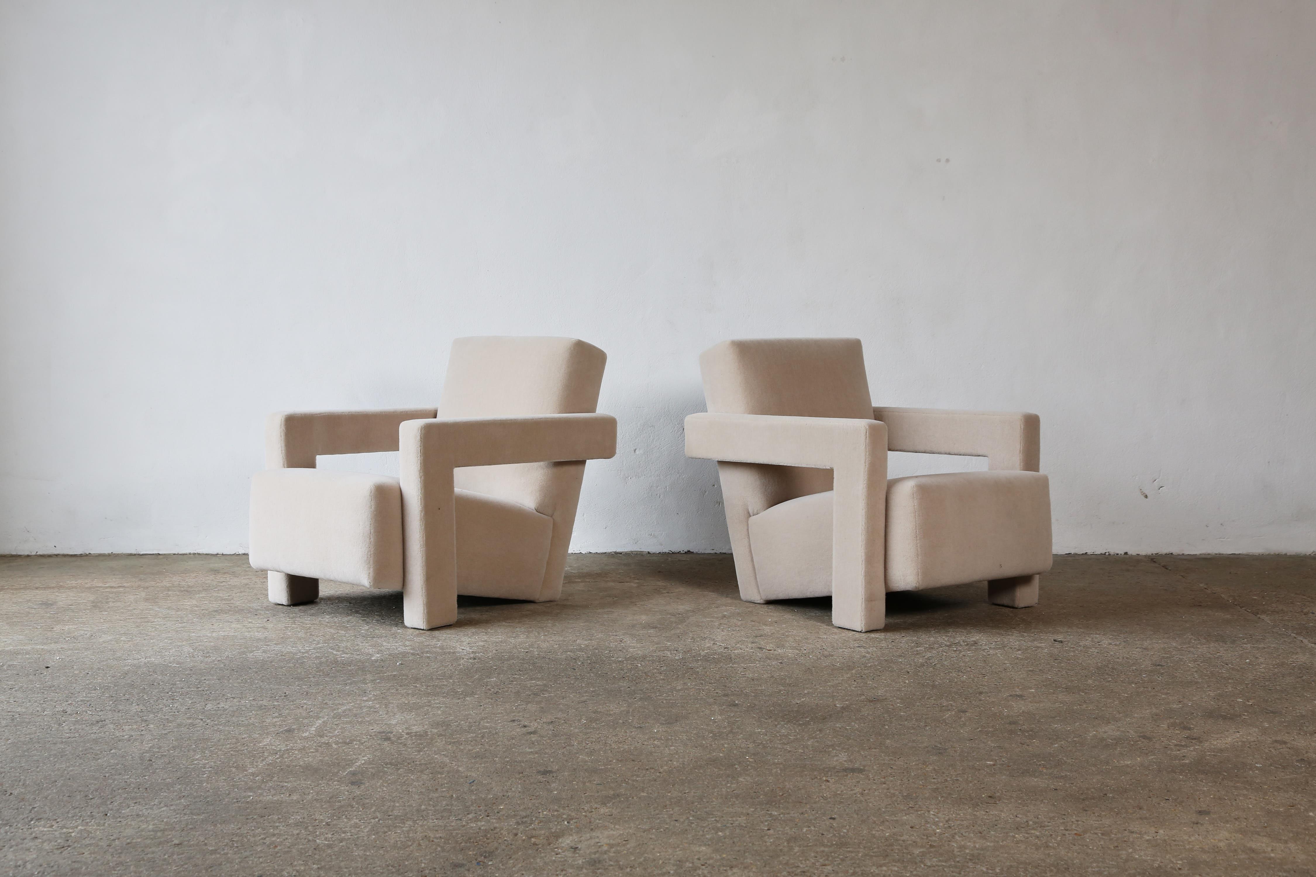 A pair of Gerrit Rietveld Utrecht armchairs, in rare XL size, produced by Cassina, and newly upholstered in a luxurious, soft, ivory pure alpaca wool fabric.  Cassina labels to the underneath.  Priced and sold as a pair together.    Fast shipping