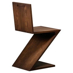 Vintage Gerrit Rietveld style Zig Zag Chair is dark brown stained wood